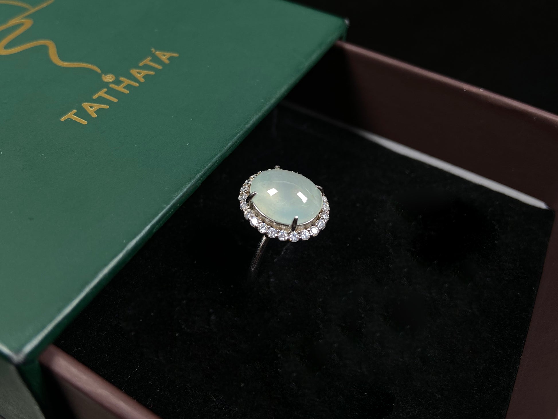 A moonlit frost glimmer jadeite ring.