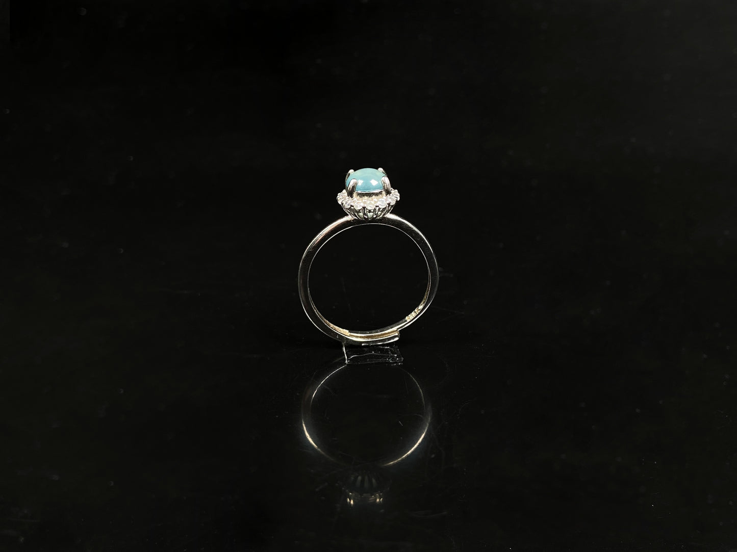 A icy sky blue glow jadeite ring.