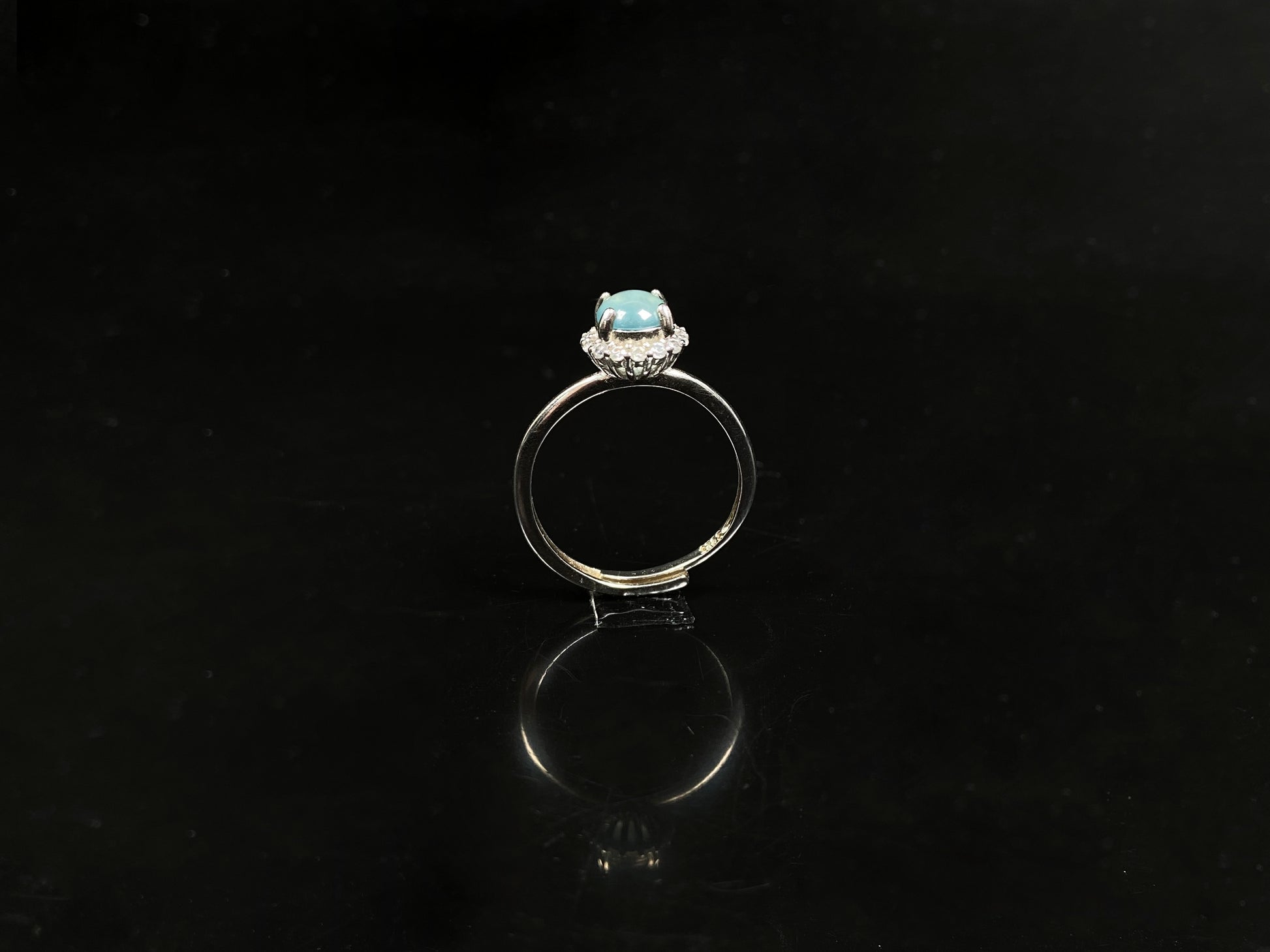 A icy sky blue glow jadeite ring.