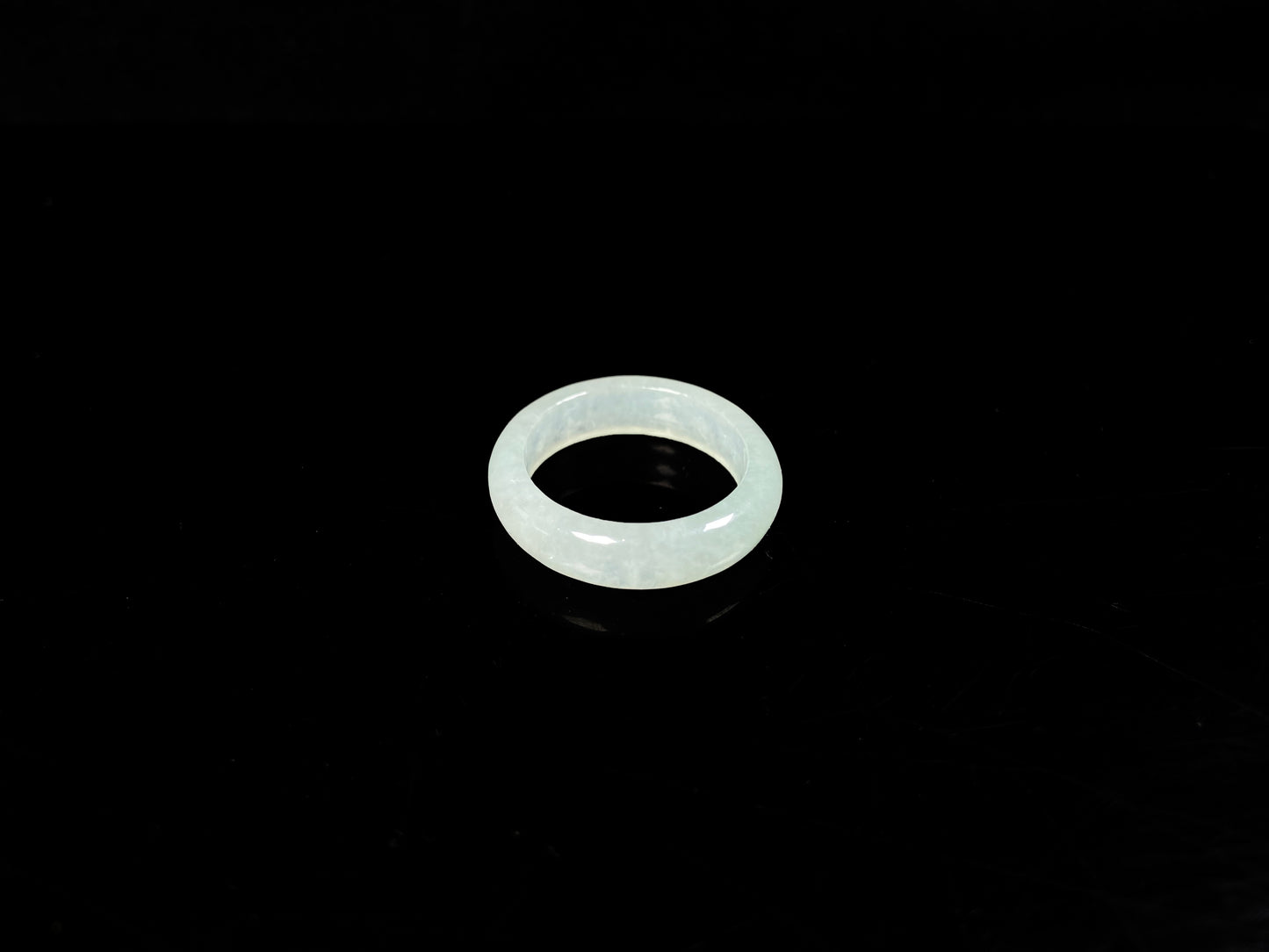 A transparent icy white jadeite ring.