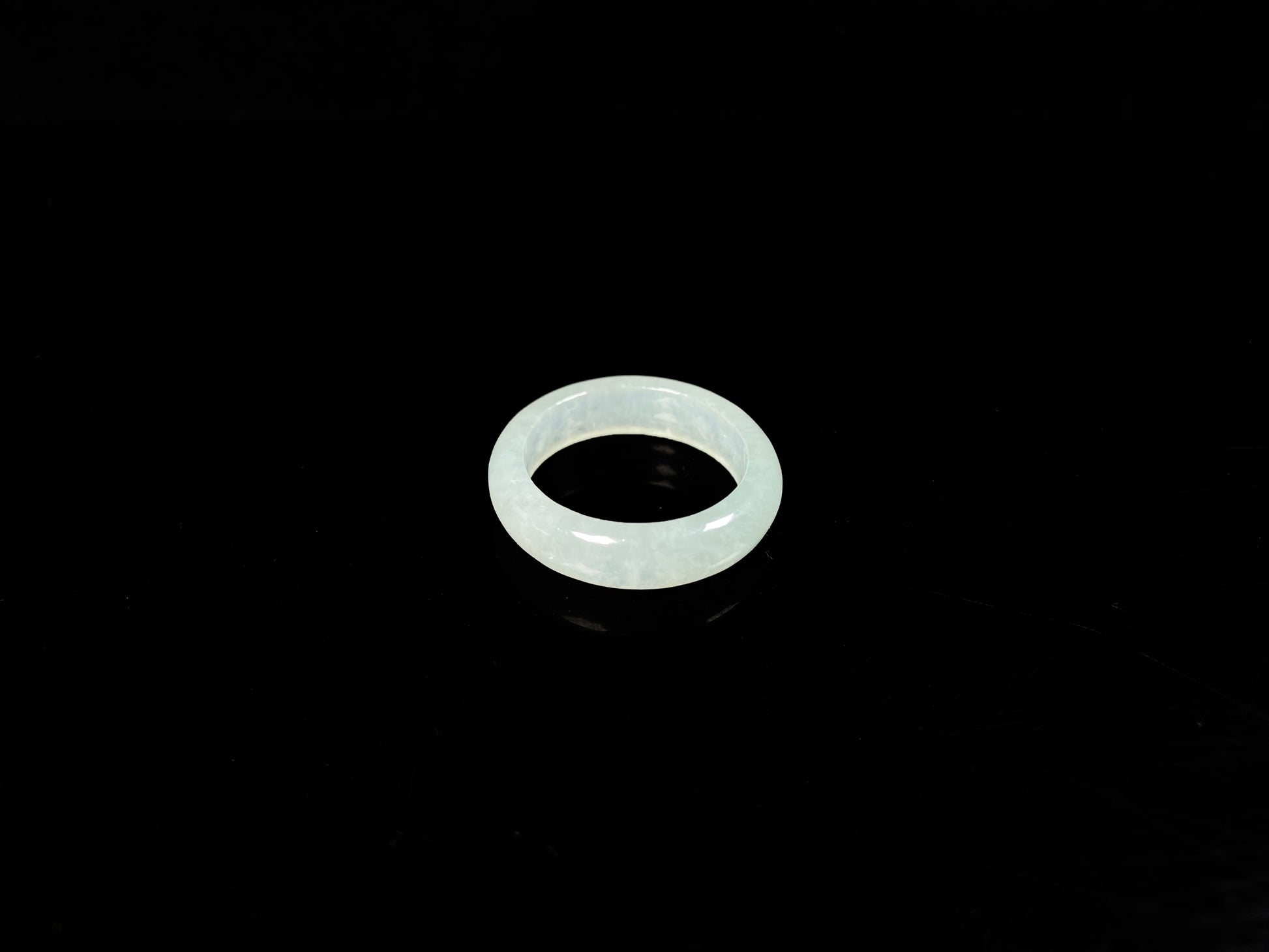 A transparent icy white jadeite ring.