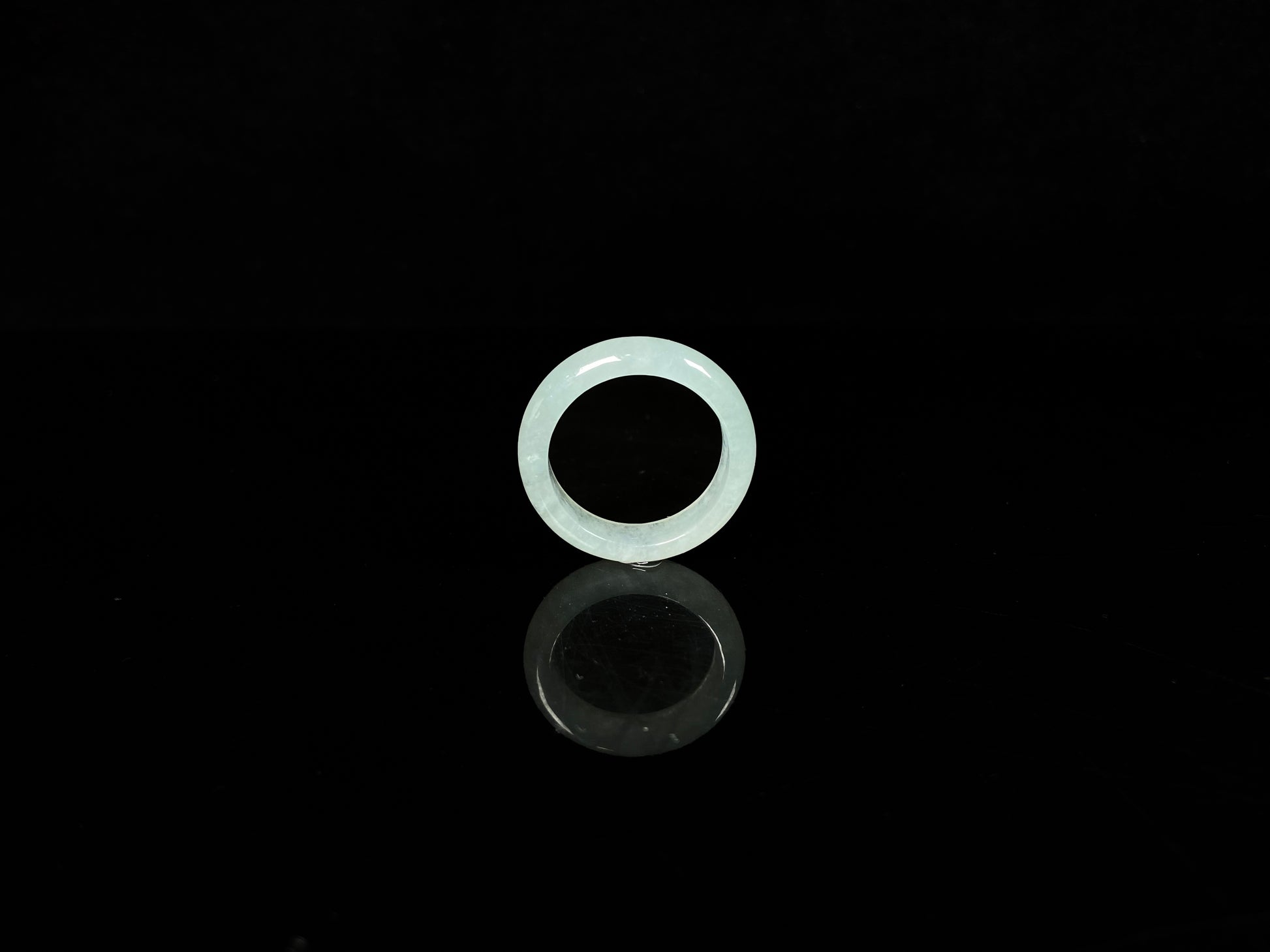 A transparent icy white jadeite ring.