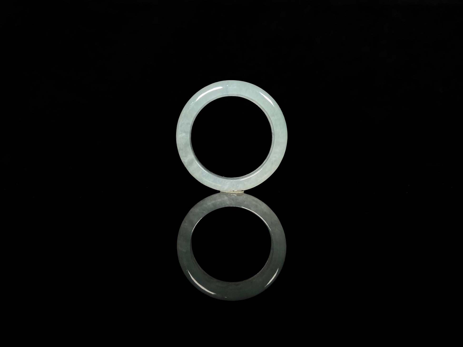 A transparent icy white jadeite ring.