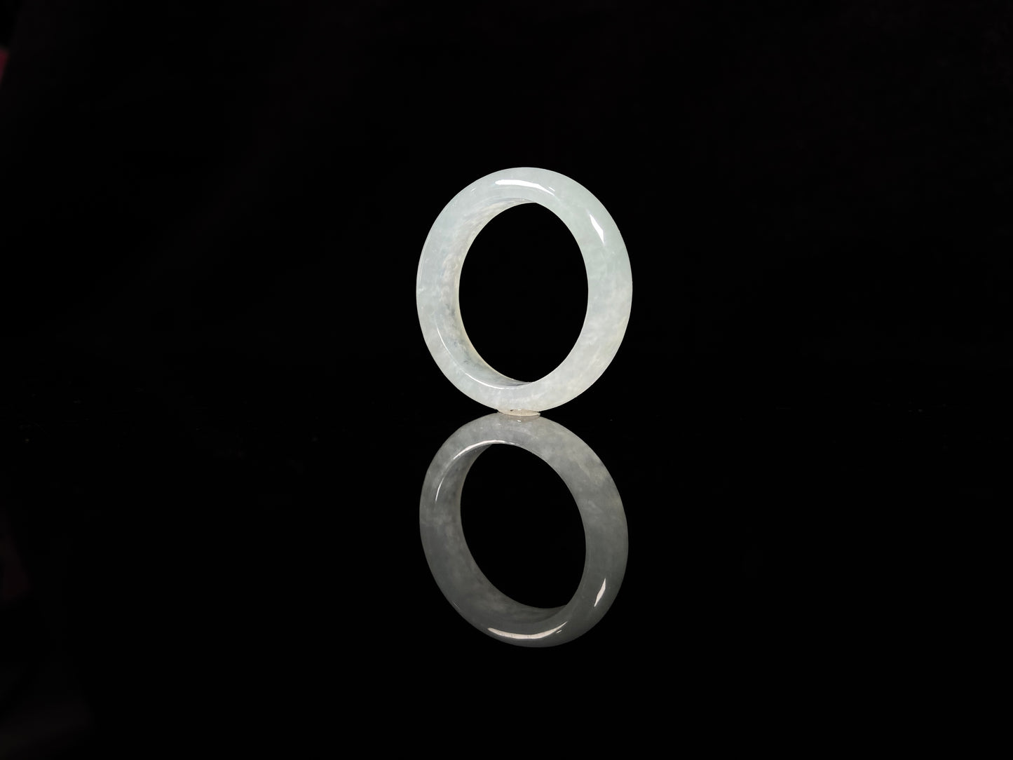 A transparent icy white jadeite ring.