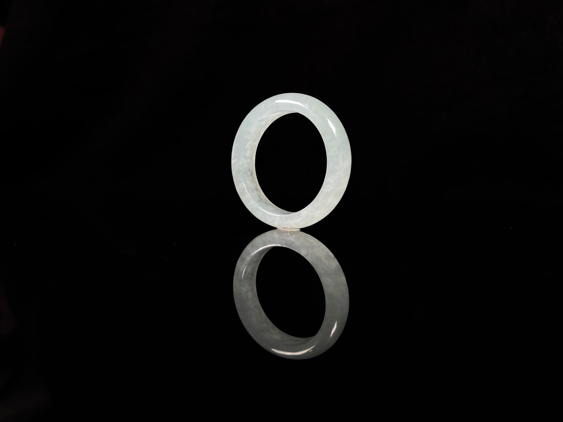 A transparent icy white jadeite ring.