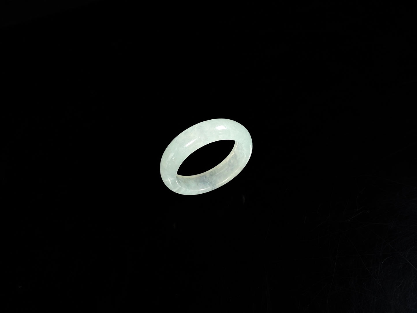A transparent icy white jadeite ring.