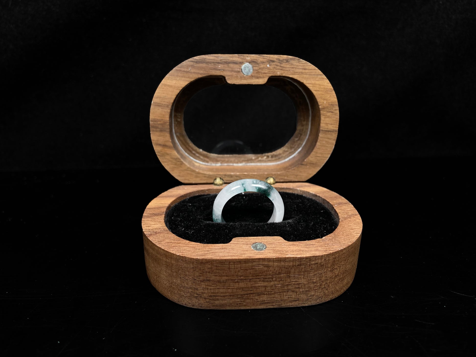 A pale white floating green jadeite ring.