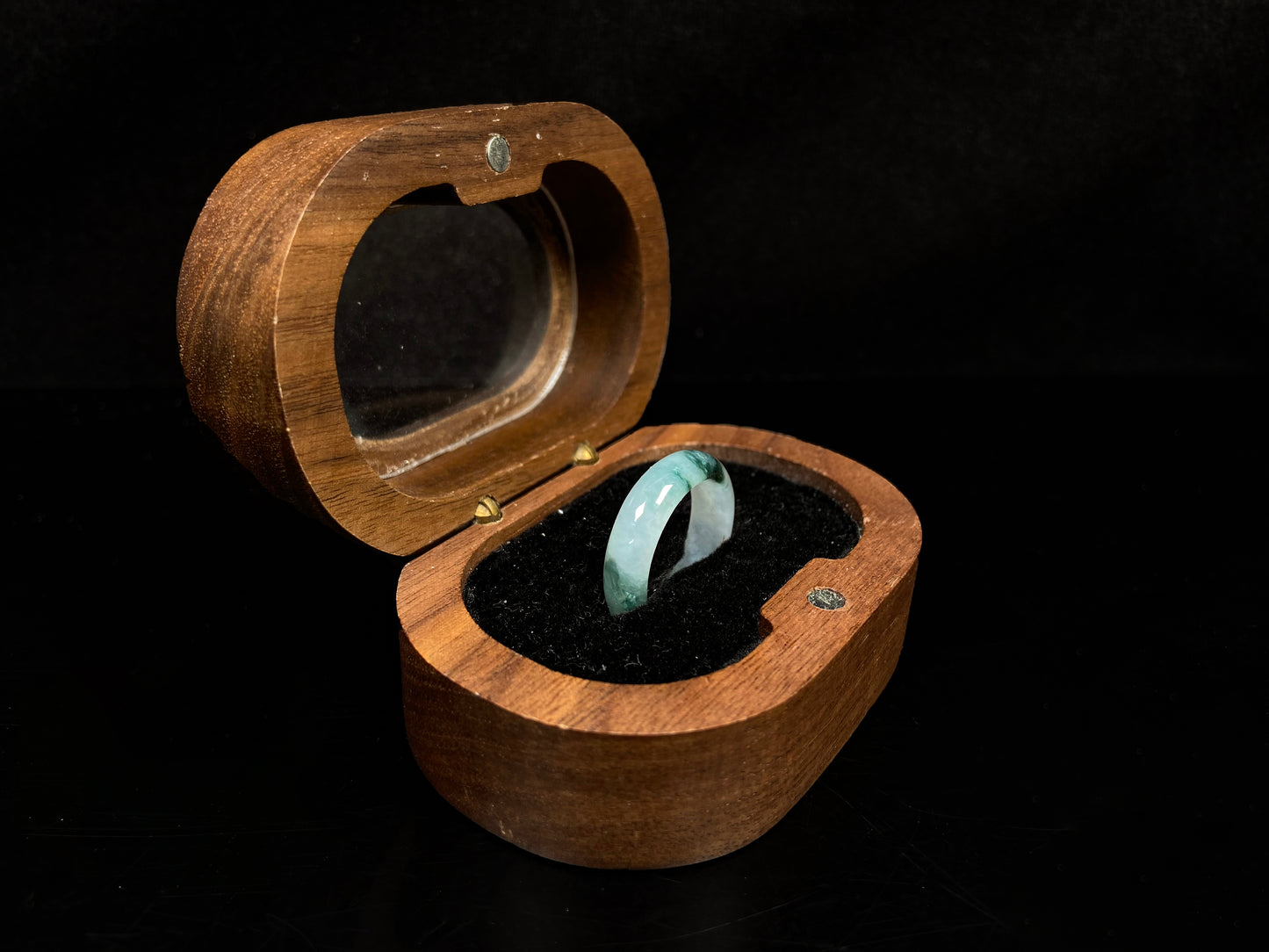 A pale white floating green jadeite ring.