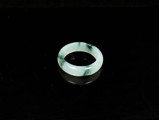 A pale white floating green jadeite ring.