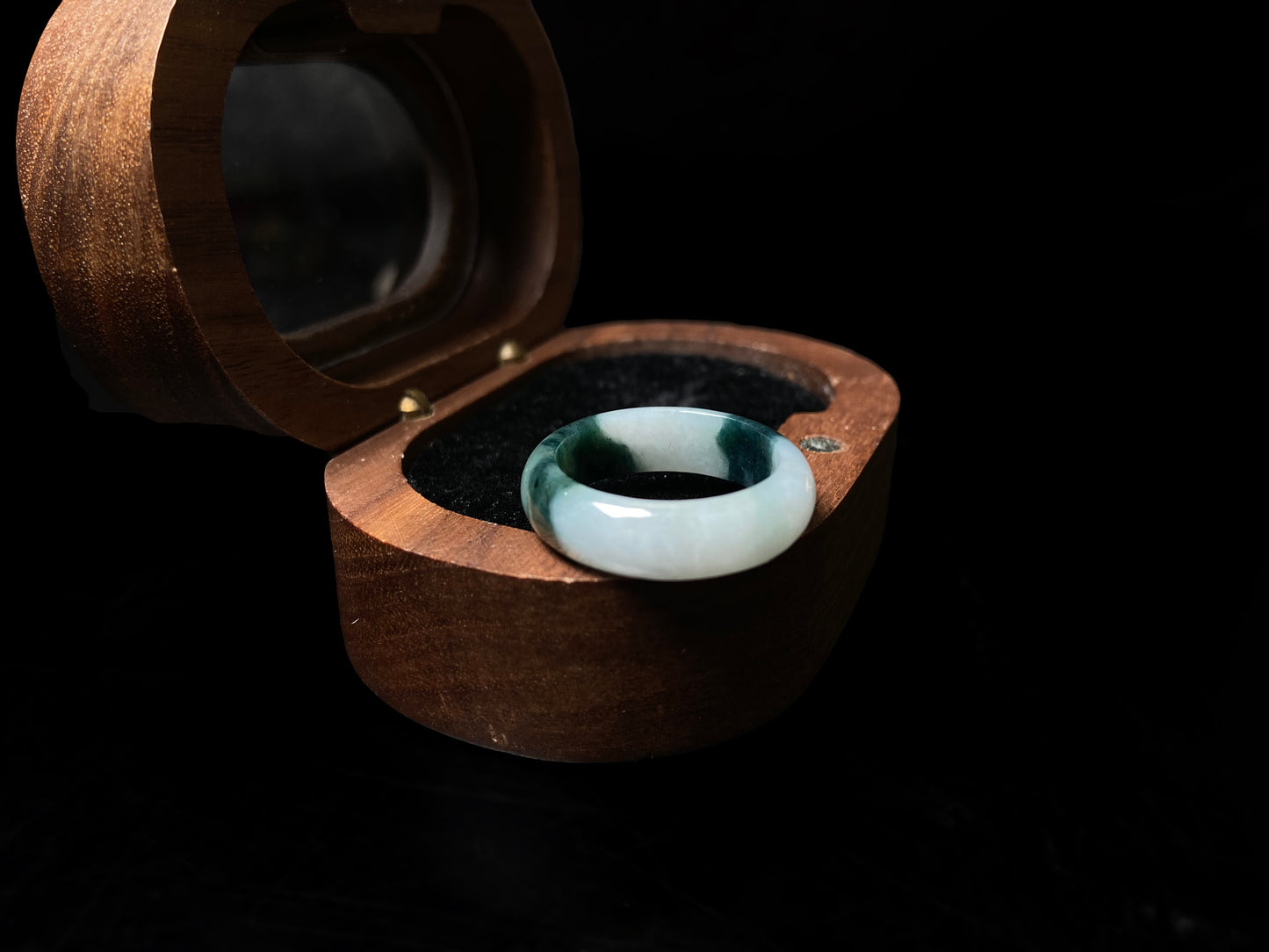 A ink green cloud jadeite ring.