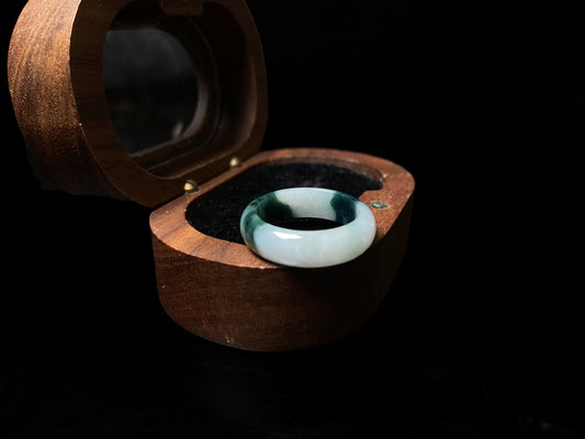 A ink green cloud jadeite ring.