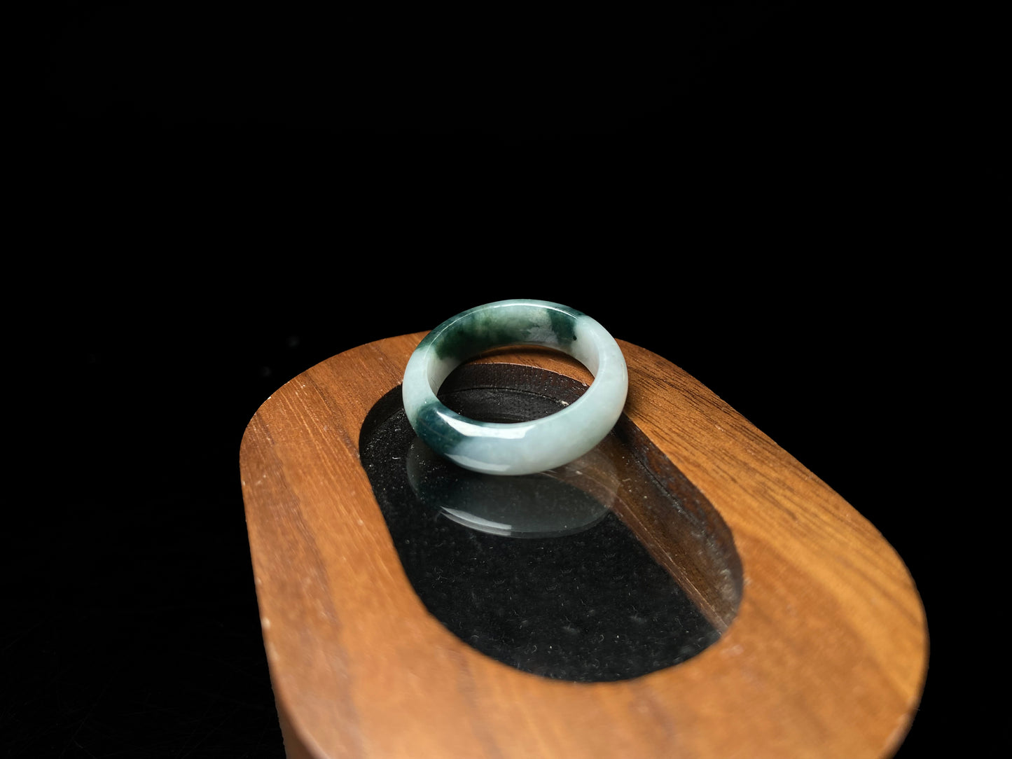 A ink green cloud jadeite ring.