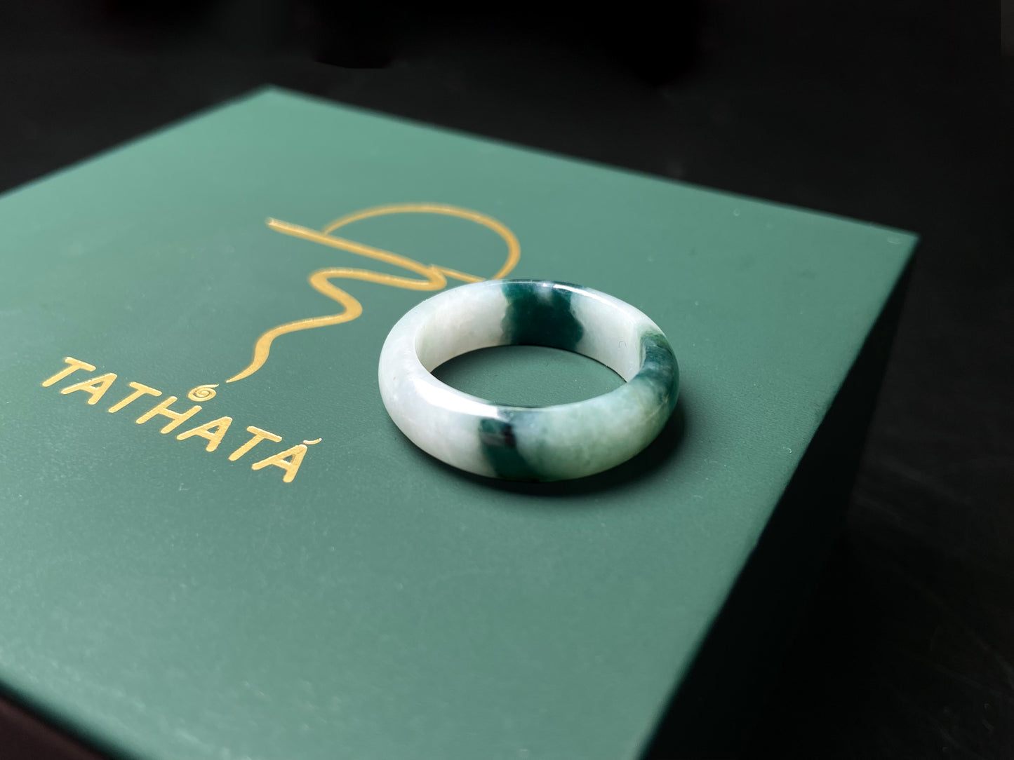 A ink green cloud jadeite ring.