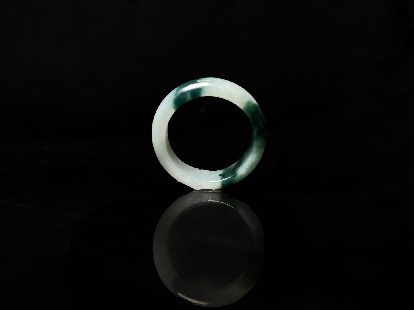 A ink green cloud jadeite ring.