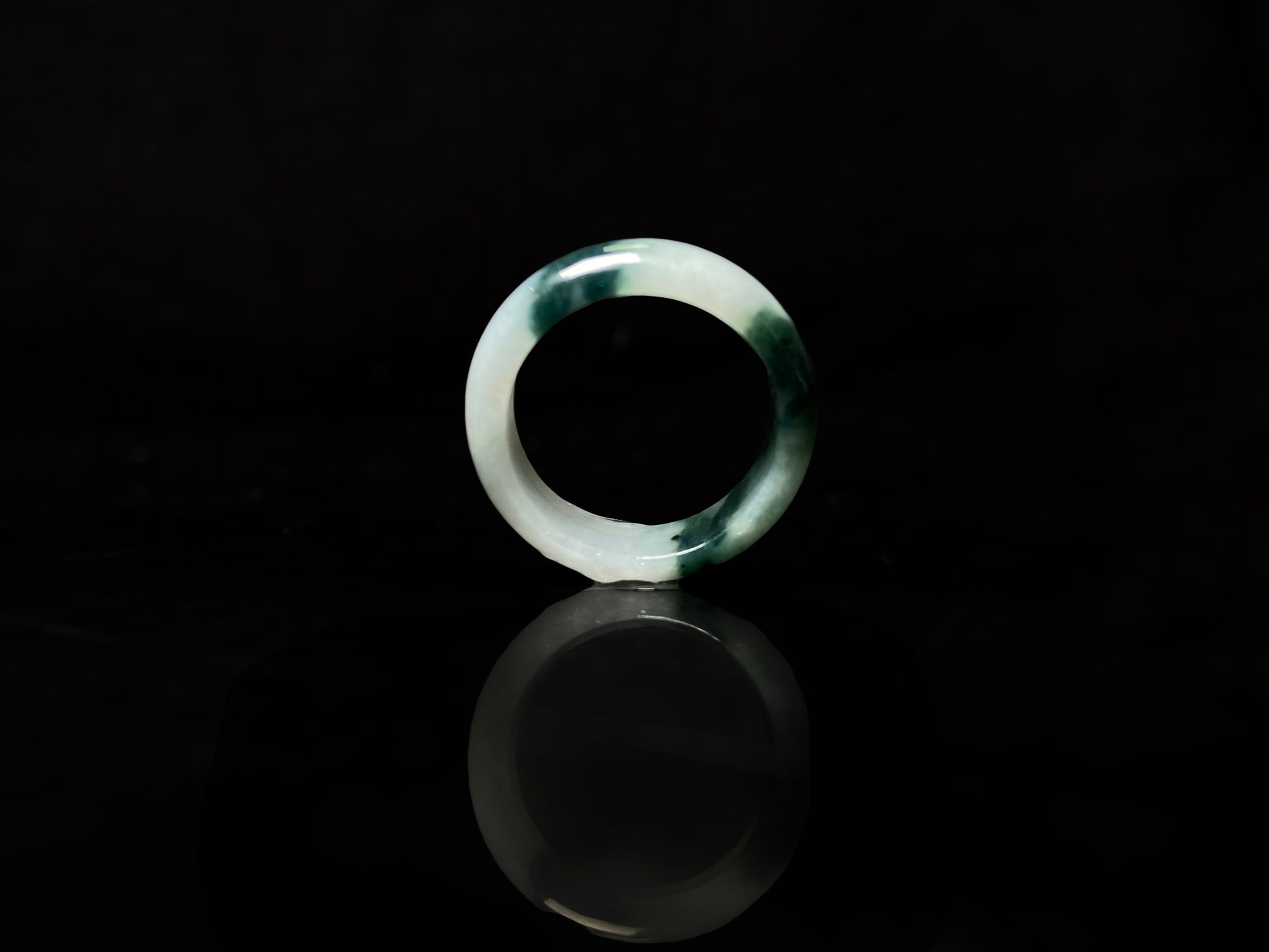 A ink green cloud jadeite ring.