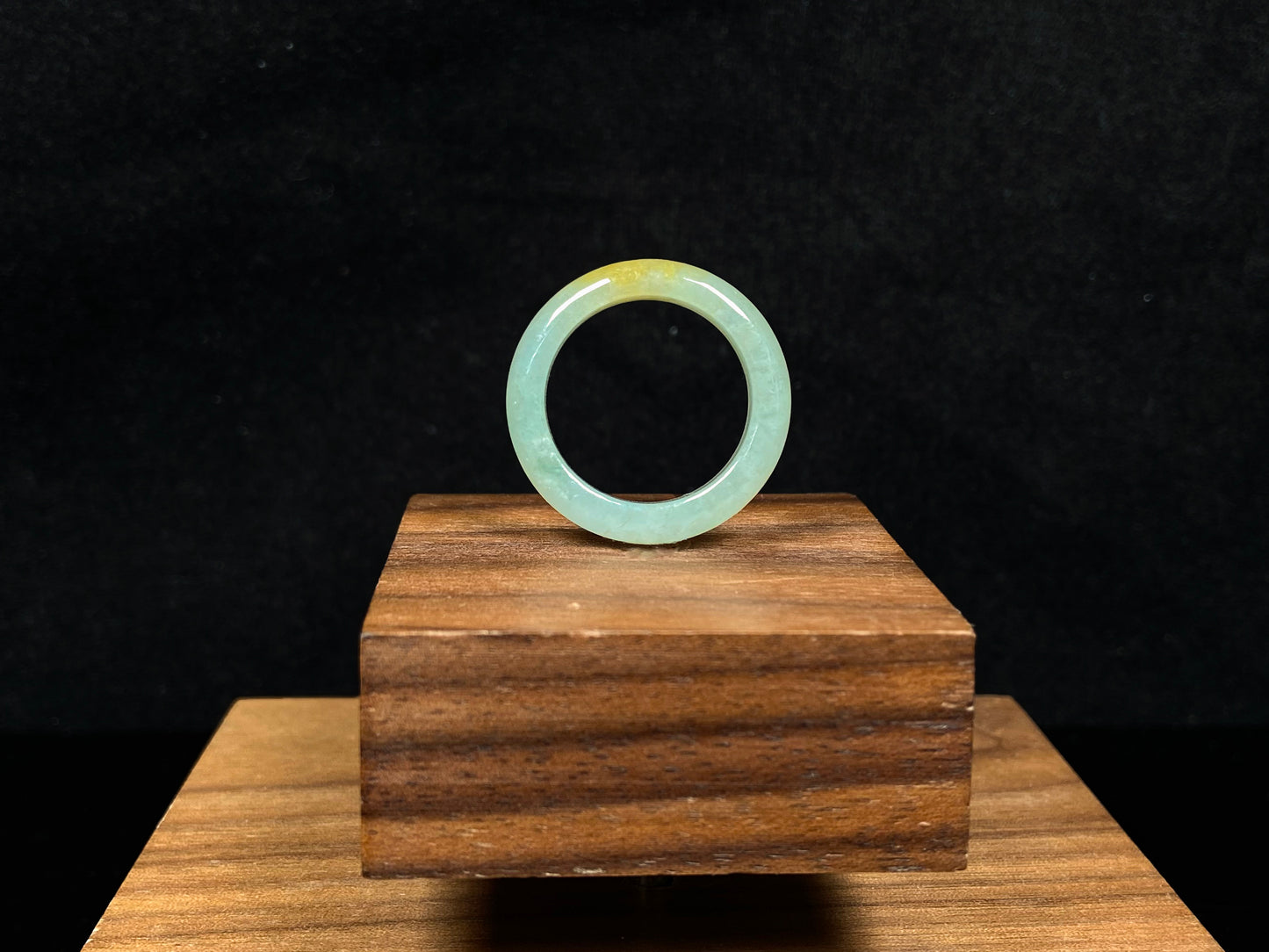 A icy yellow green smooth jadeite ring.