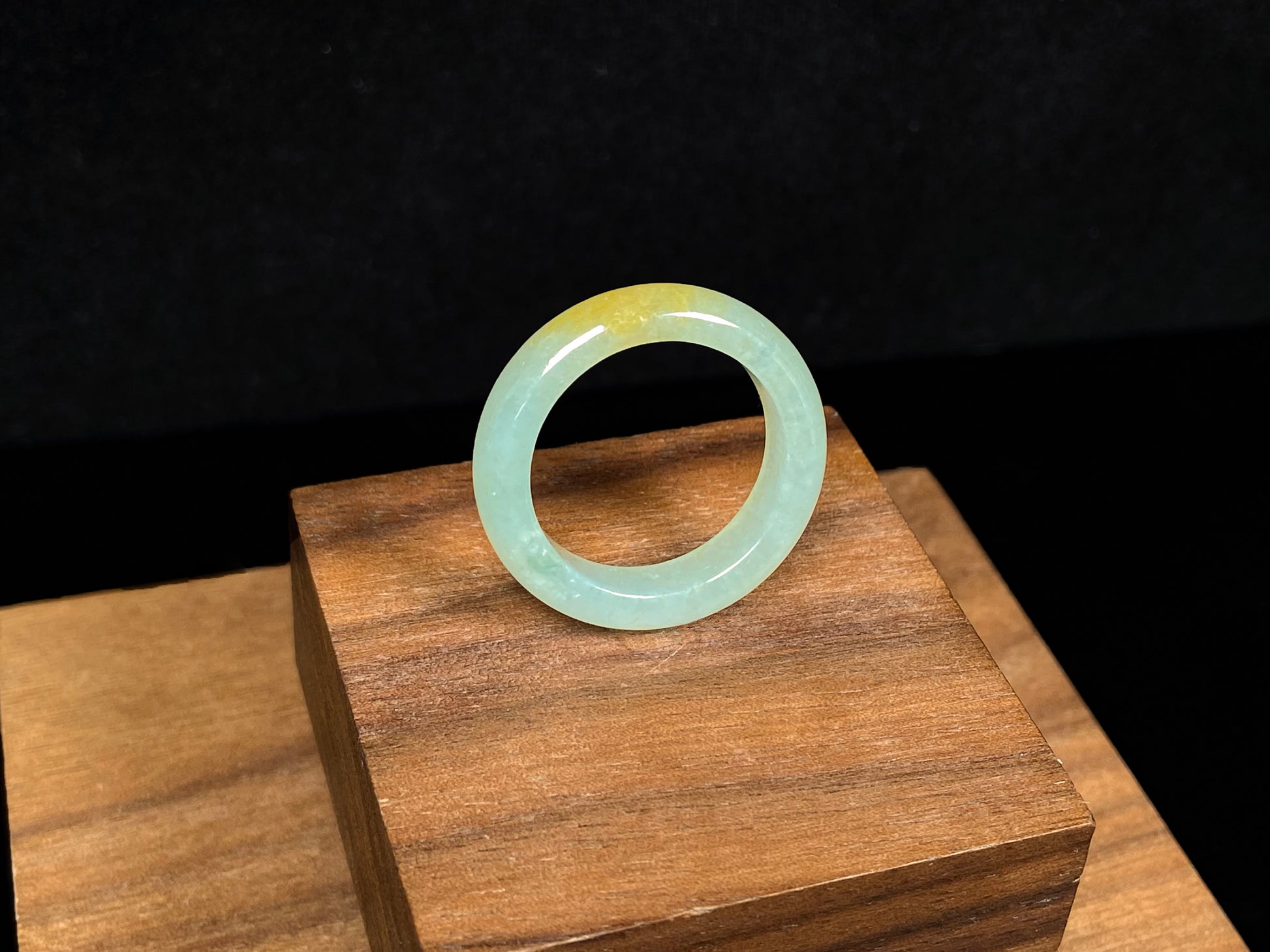 A icy yellow green smooth jadeite ring.
