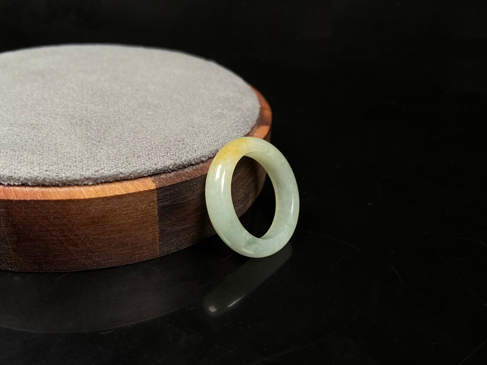 A icy yellow green smooth jadeite ring.