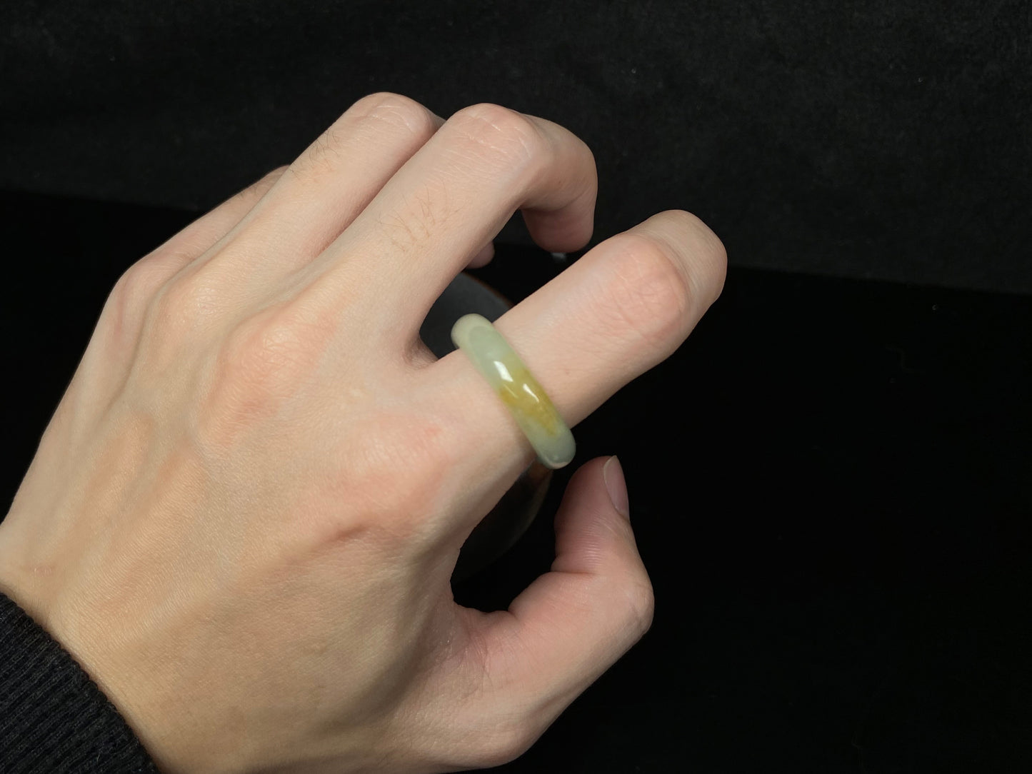 A icy yellow green smooth jadeite ring.