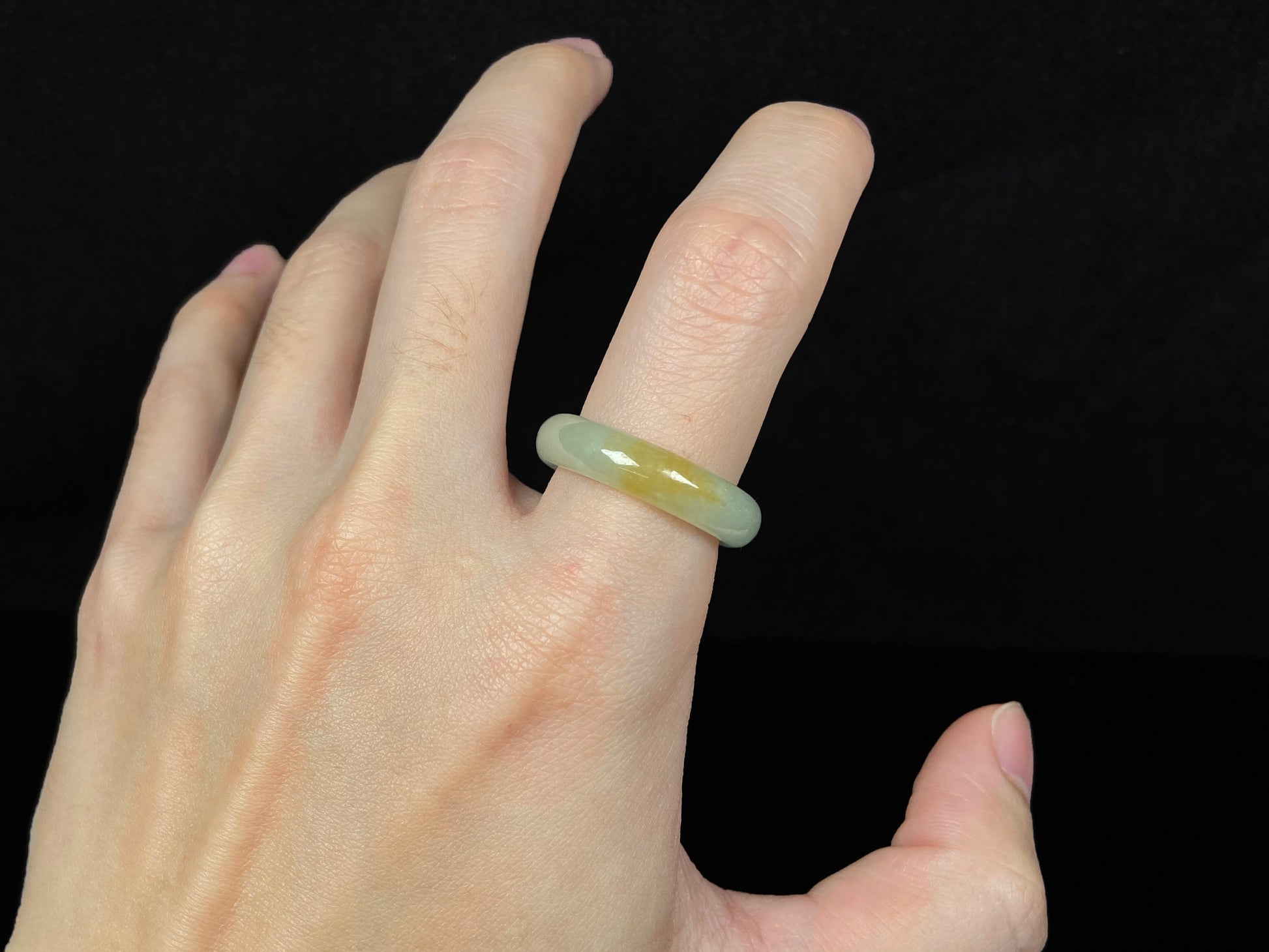 A icy yellow green smooth jadeite ring.