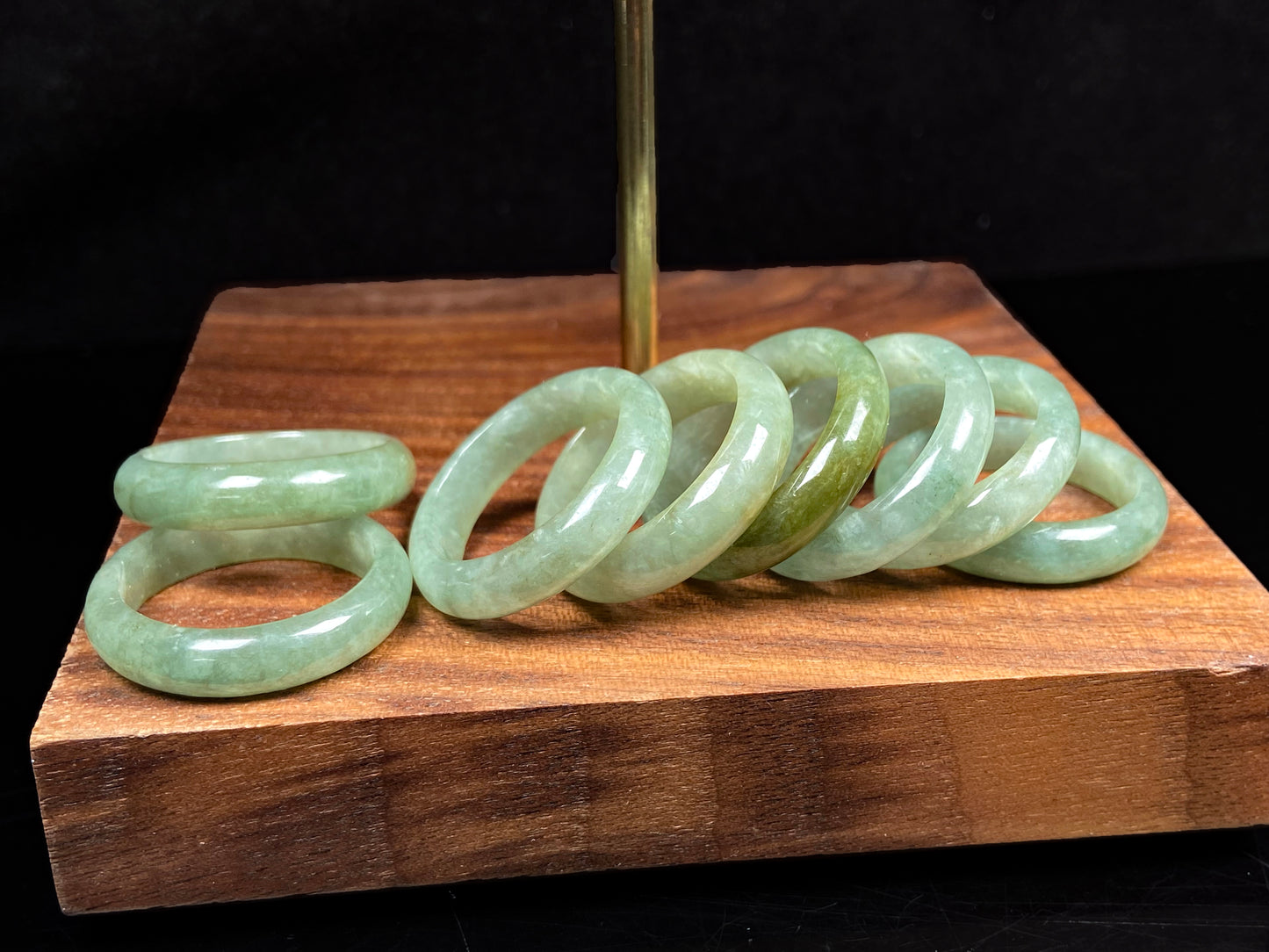 A group of pale mossy green jadeite ring.