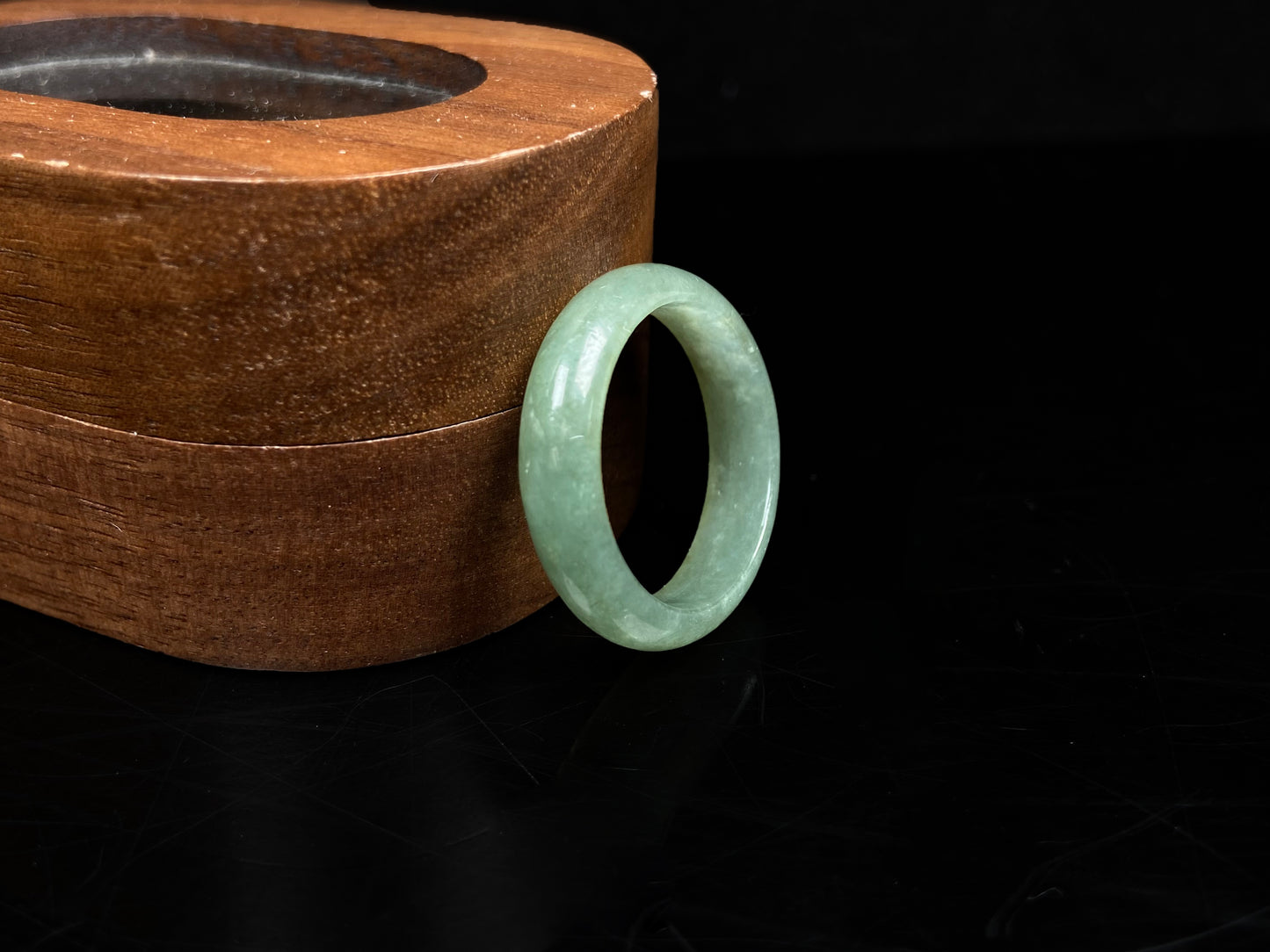 A pale mossy green jadeite ring.