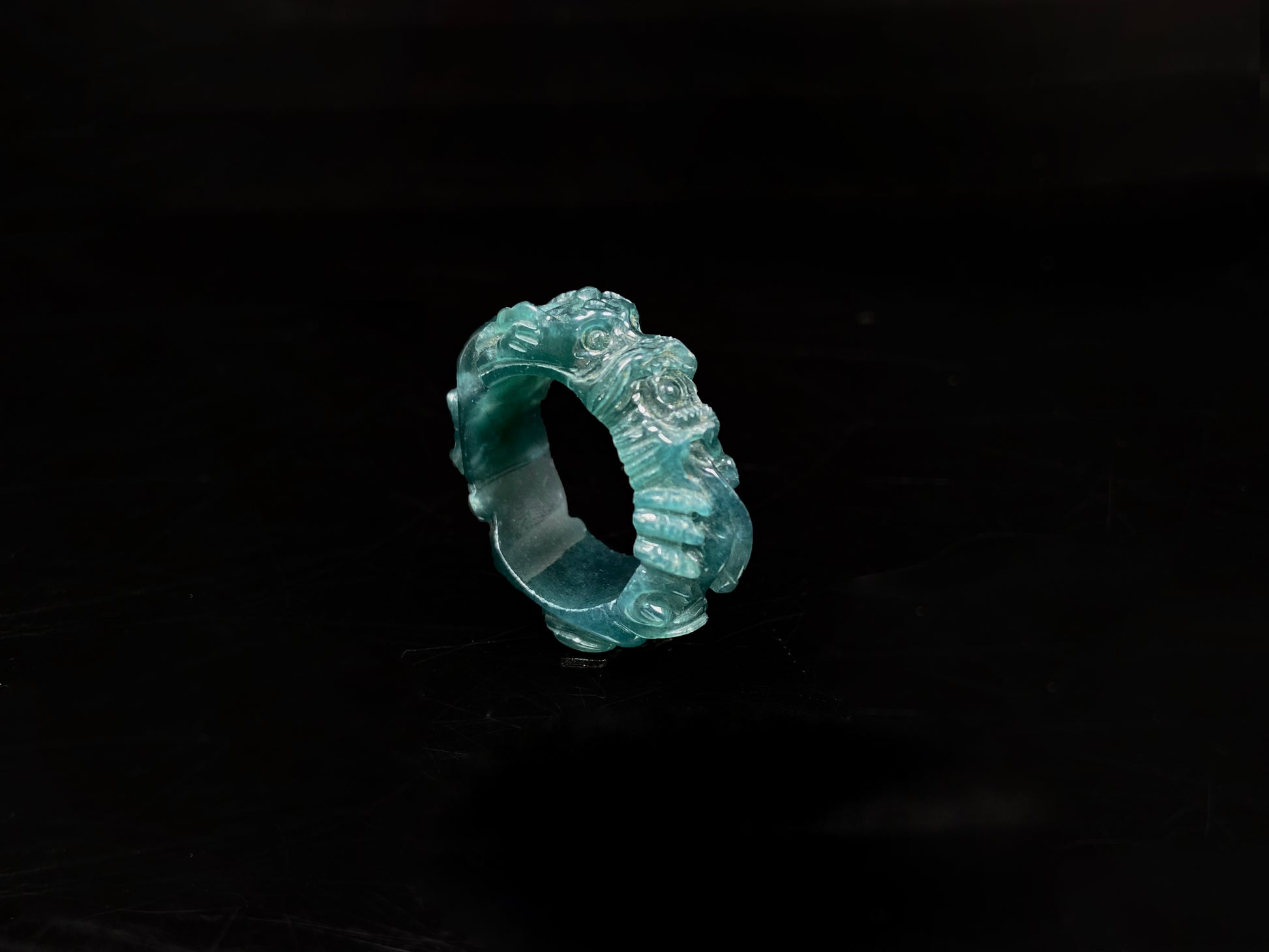 A ocean blue dragon jadeite ring.