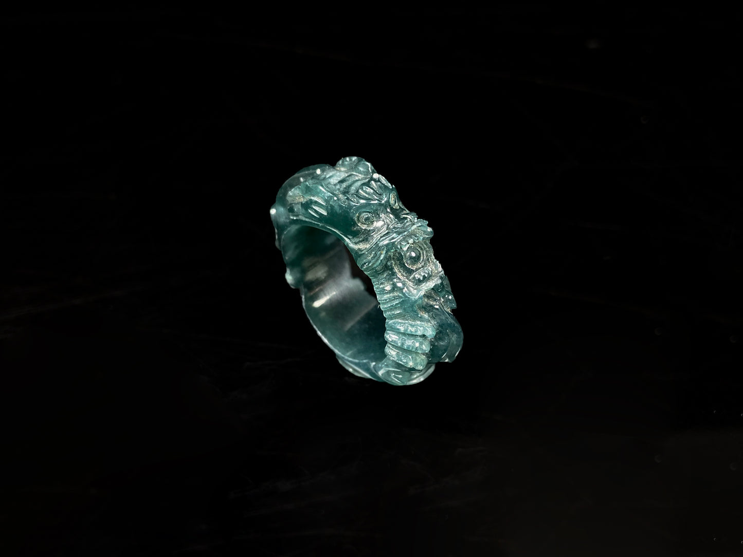 A ocean blue dragon jadeite ring.