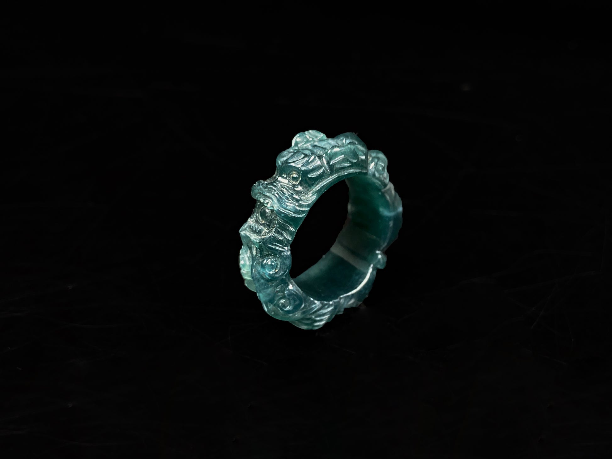 A ocean blue dragon jadeite ring.