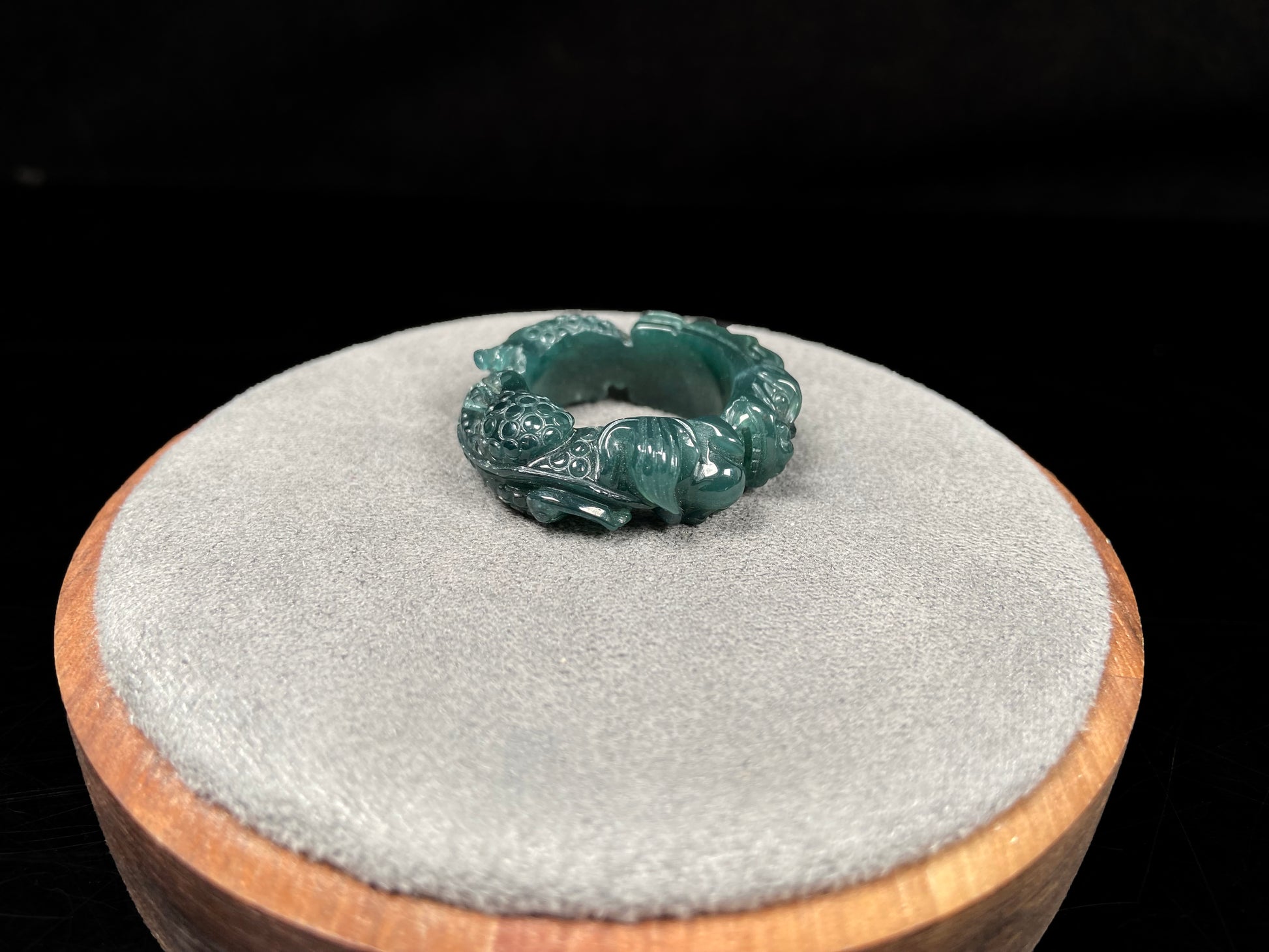 A rich teal dragon jadeite ring.