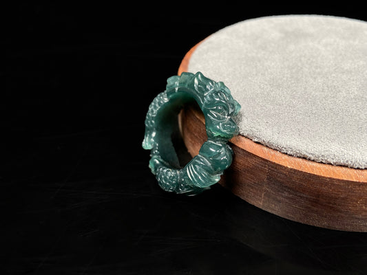 A rich teal dragon jadeite ring.