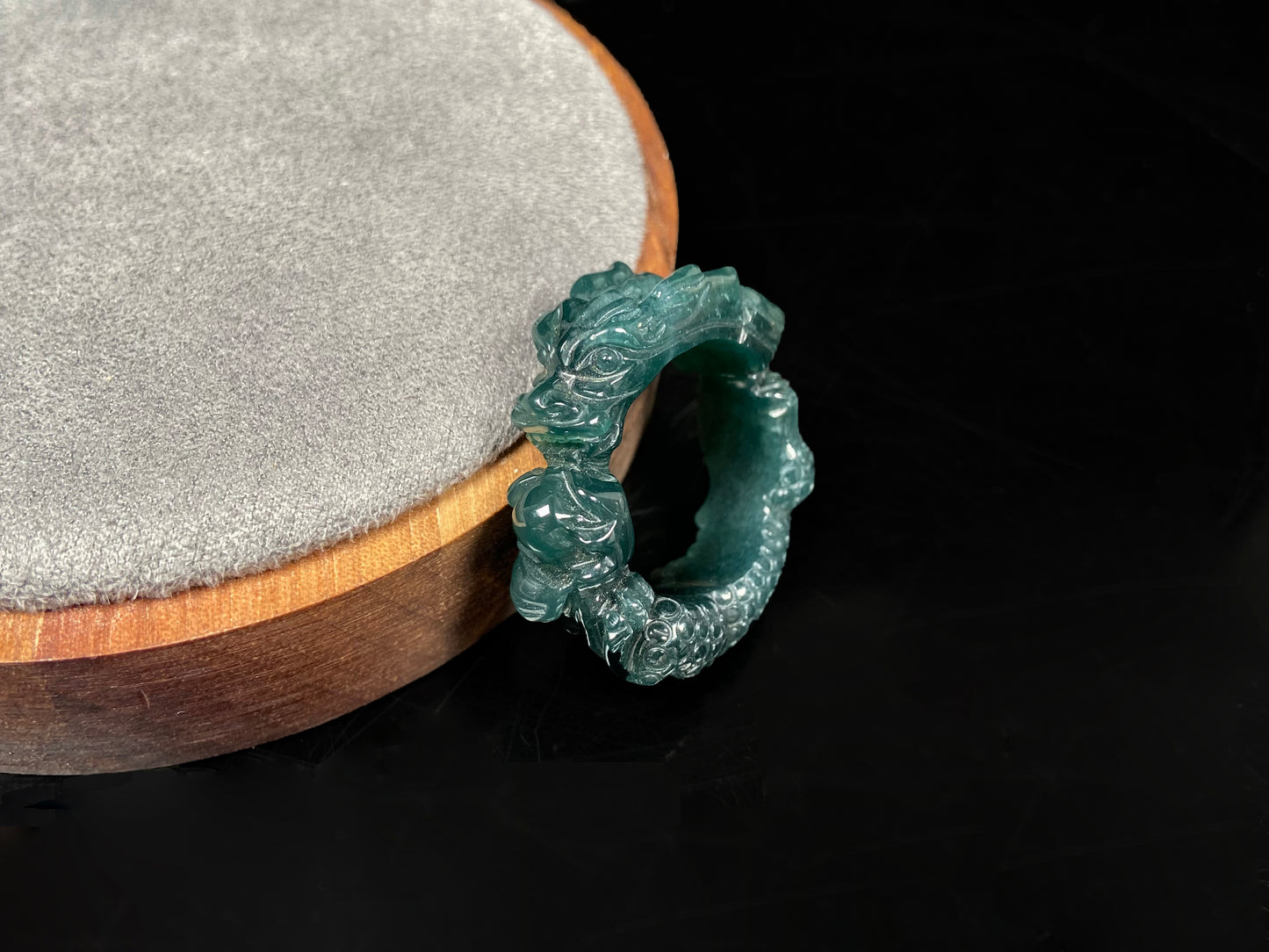 A rich teal dragon jadeite ring.