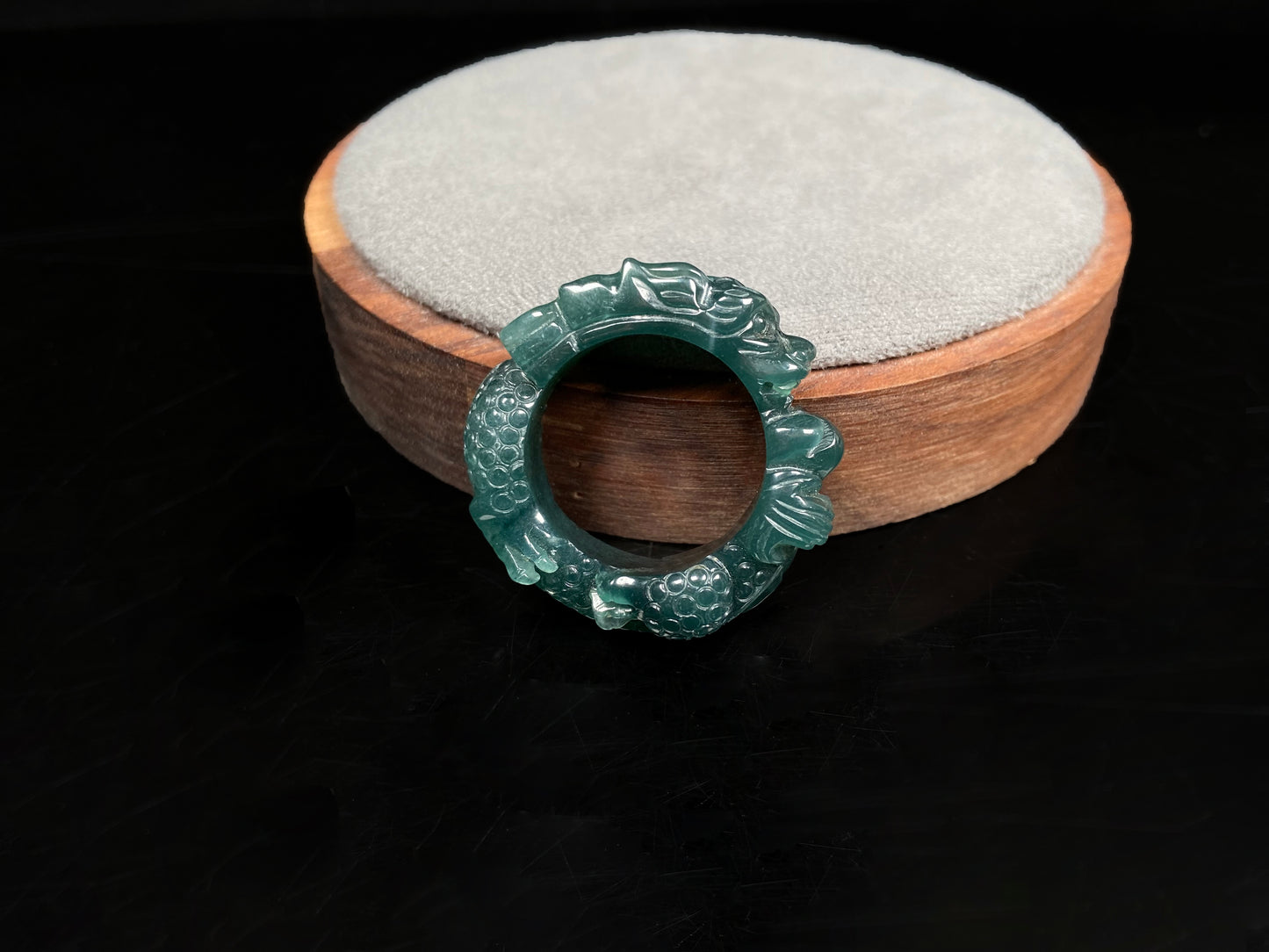 A rich teal dragon jadeite ring.