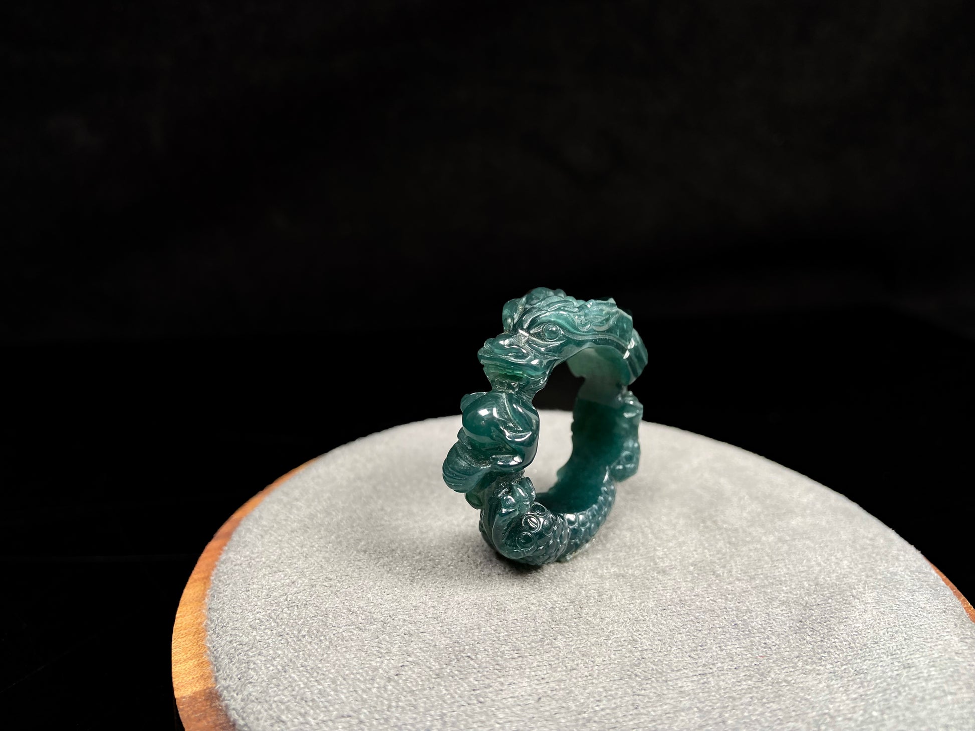 A rich teal dragon jadeite ring.