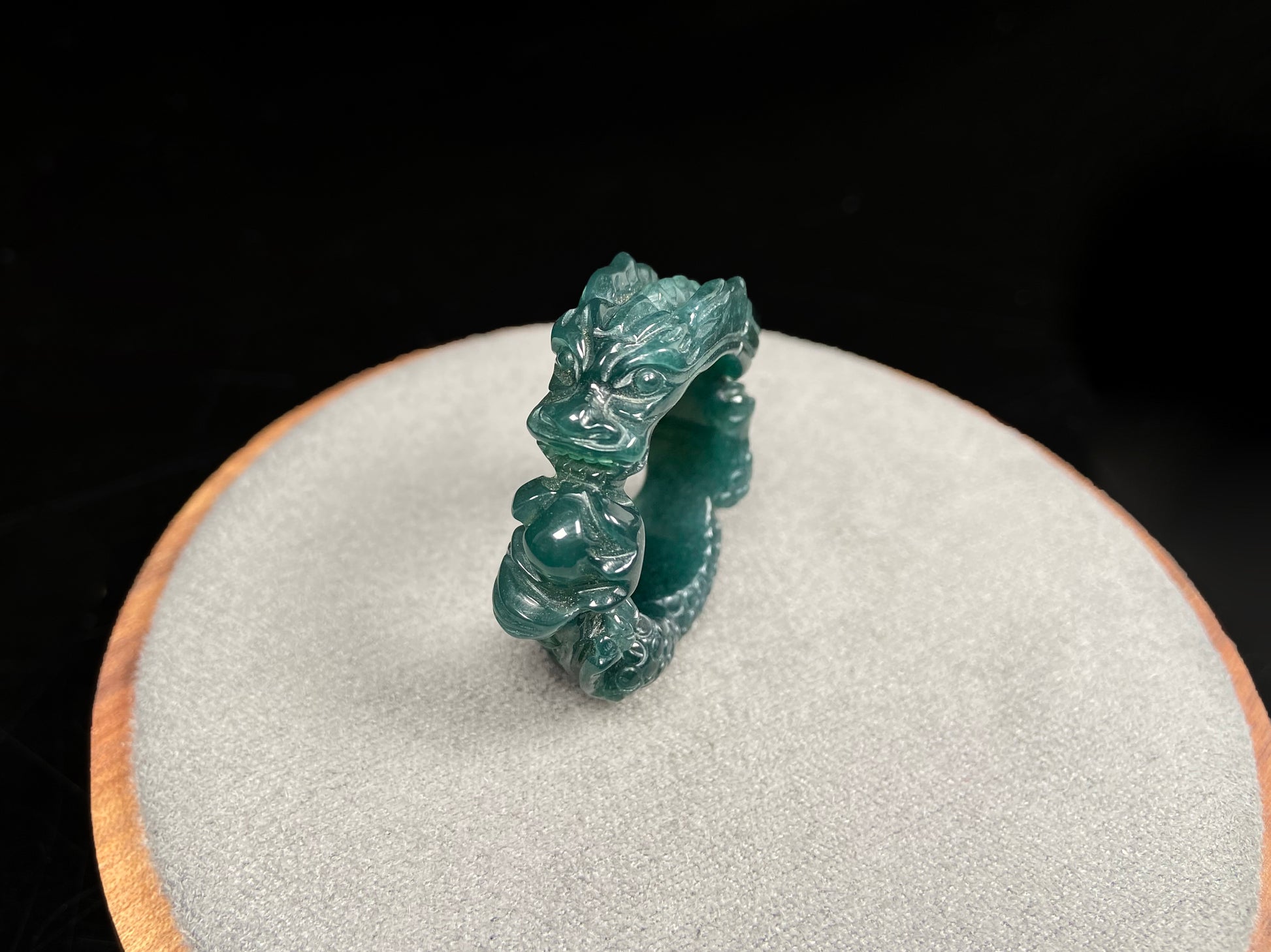 A rich teal dragon jadeite ring.