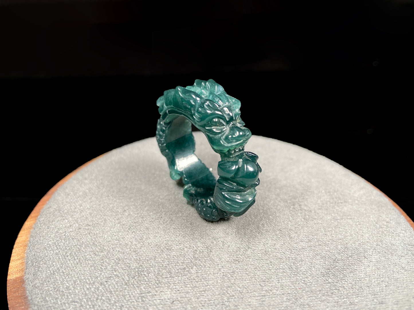 A rich teal dragon jadeite ring.