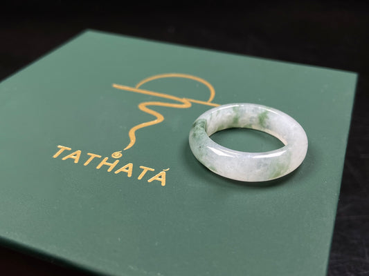 A misty base with green shadow jadeite ring.