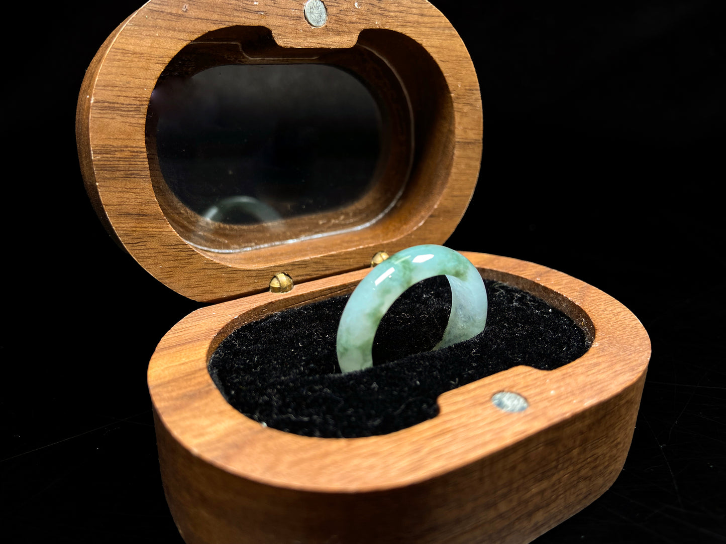 A misty base with green shadow jadeite ring.