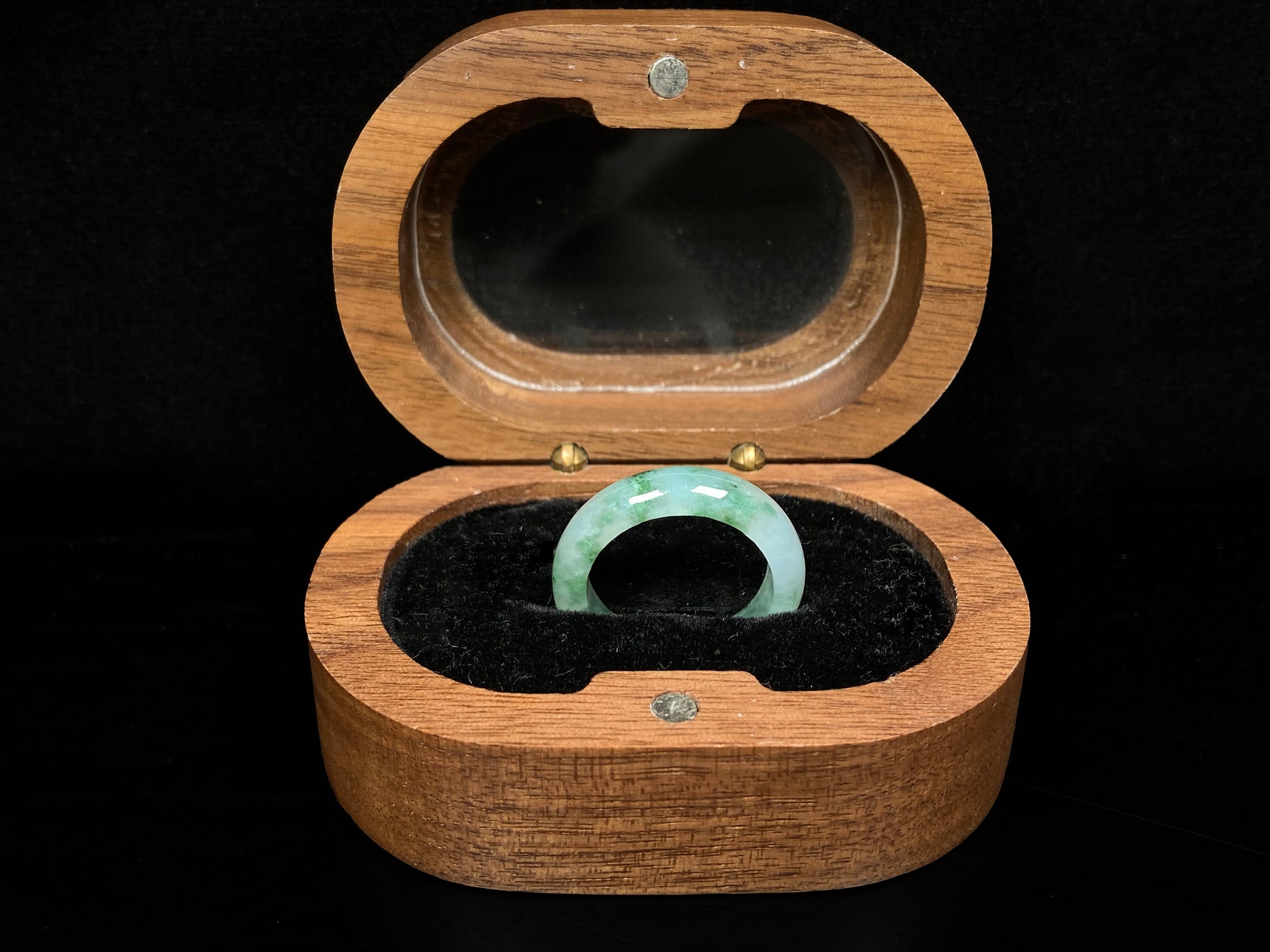 A misty base with green shadow jadeite ring.