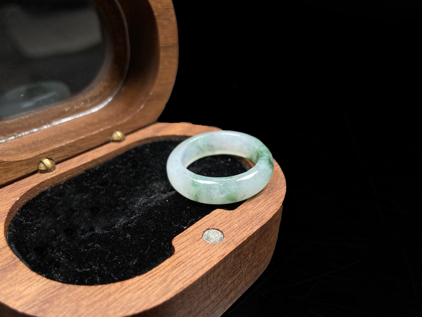 A misty base with green shadow jadeite ring.