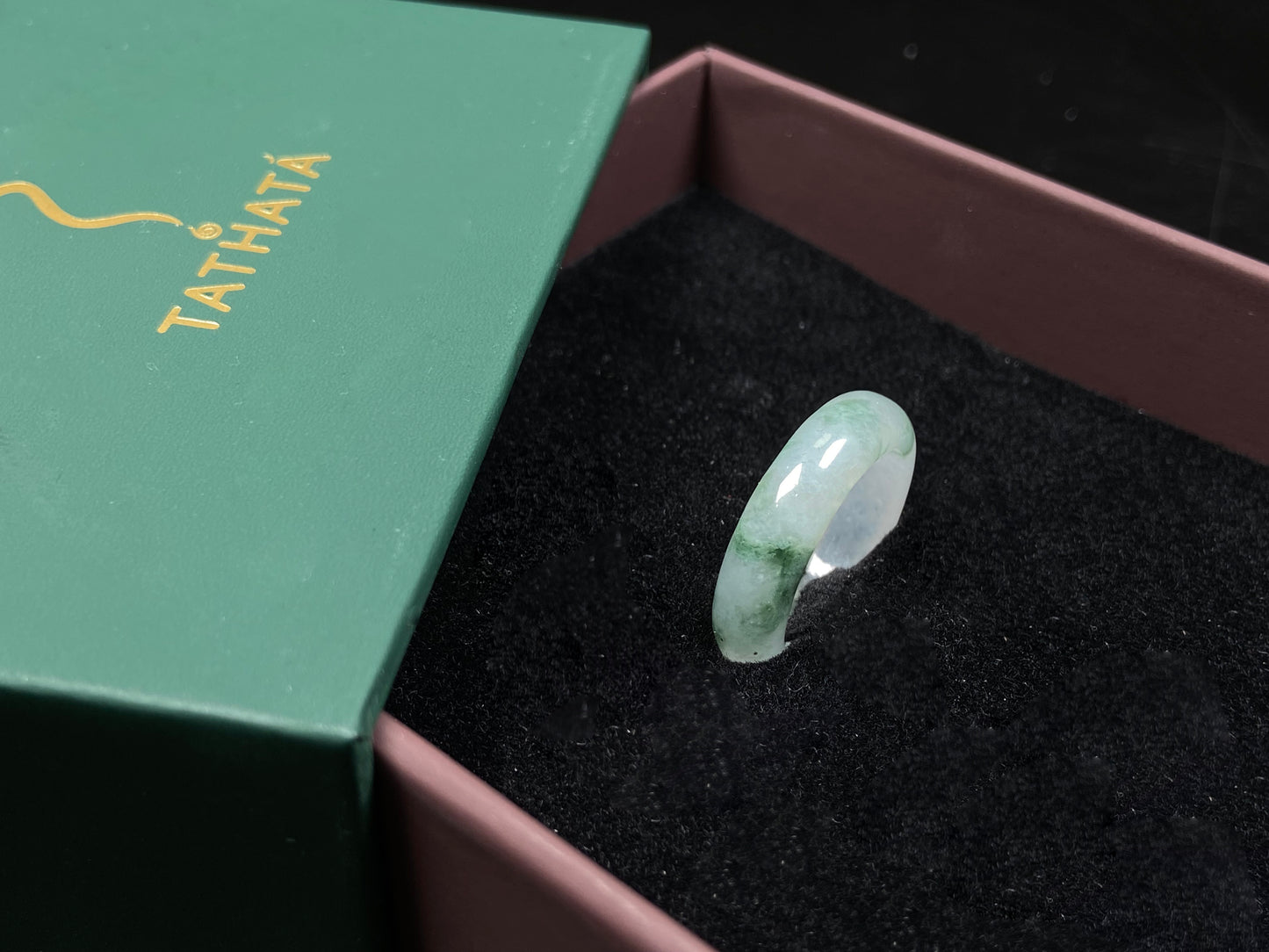 A misty base with green shadow jadeite ring.