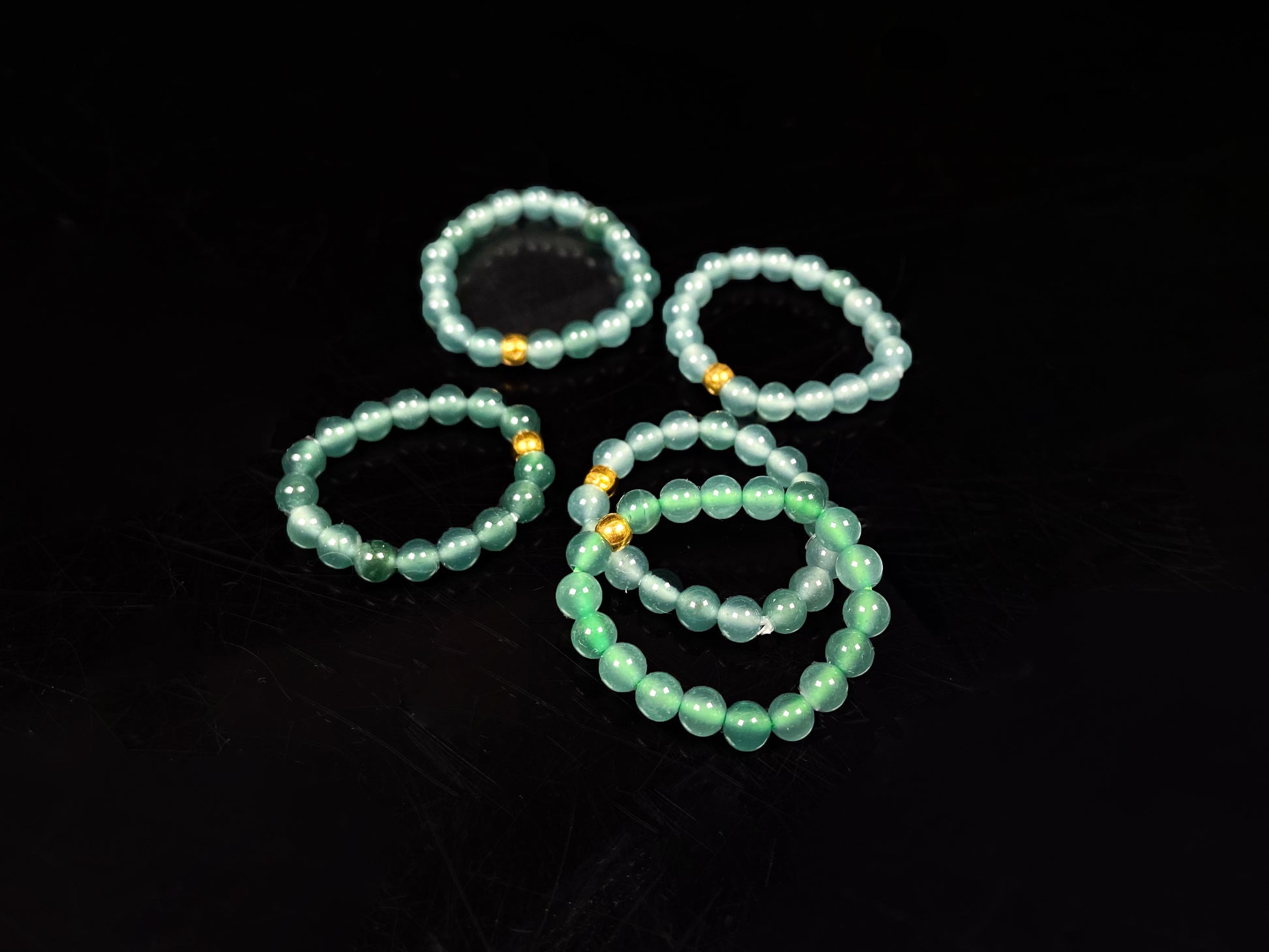 A gold center glacier blue jadeite ring.
