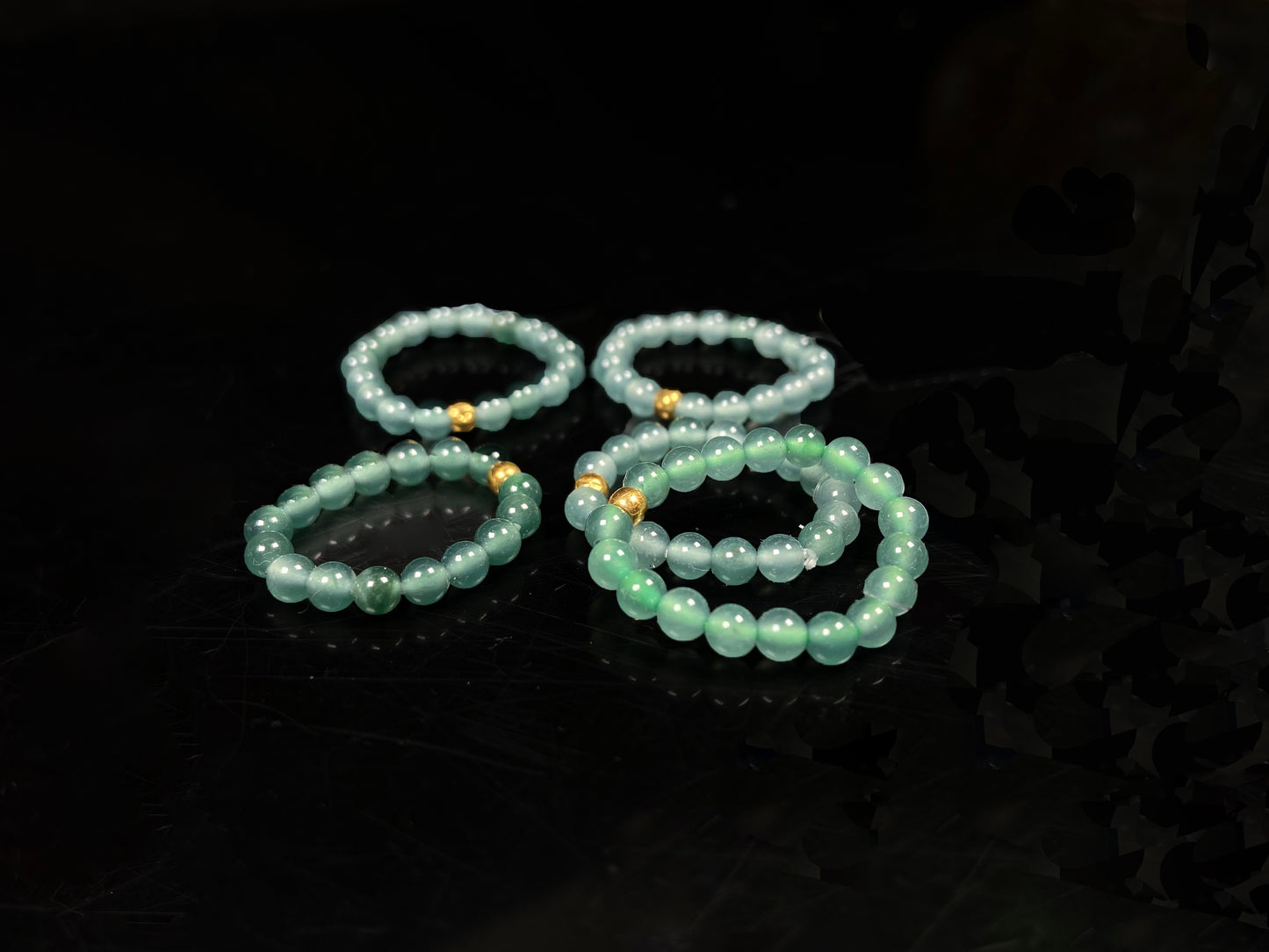 A gold center glacier blue jadeite ring.