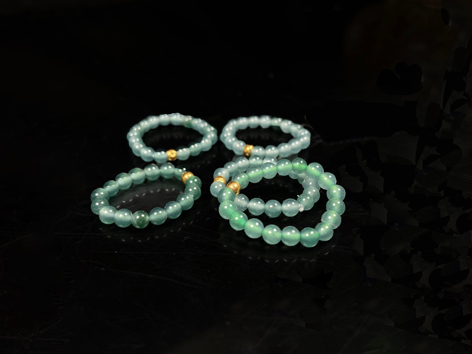 A gold center glacier blue jadeite ring.