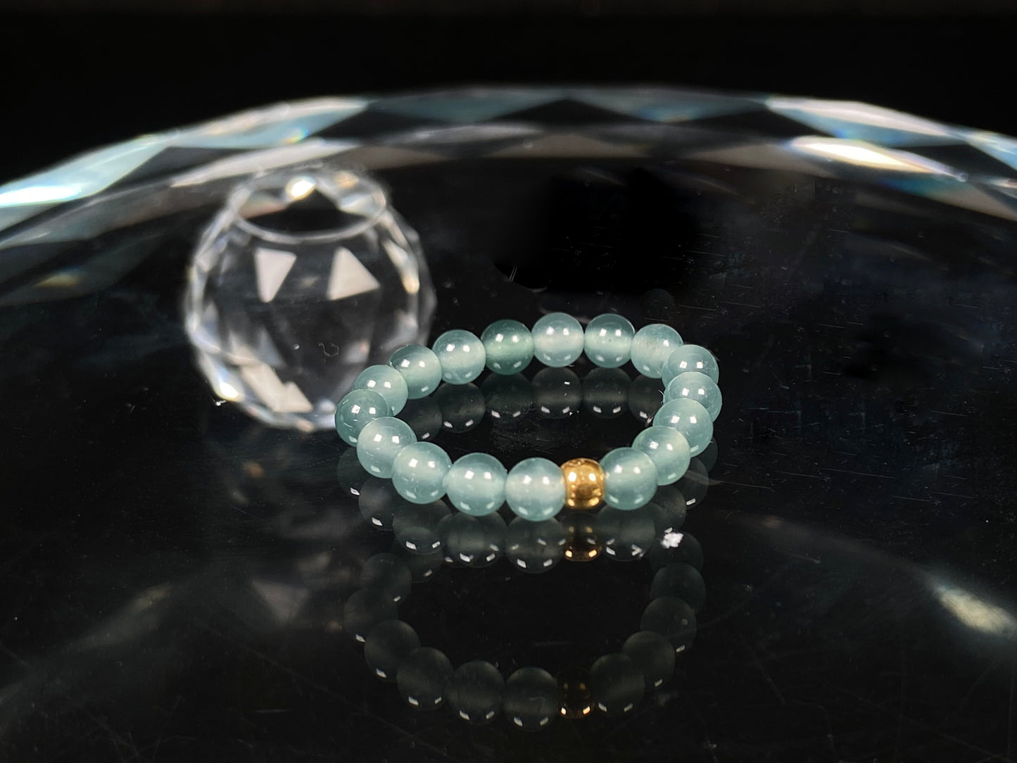 A gold center glacier blue jadeite ring.