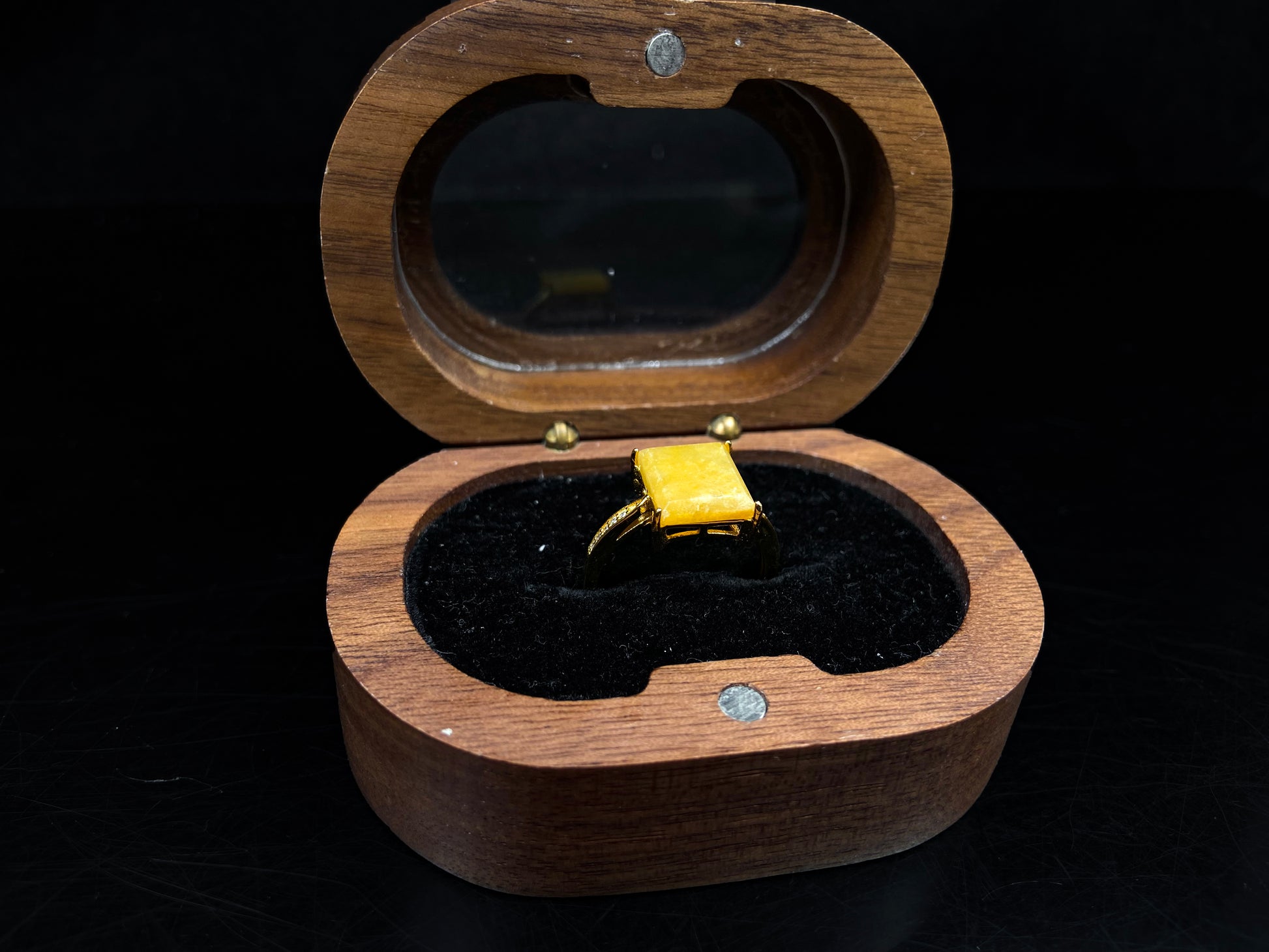 A rich yellow square jadeite ring.