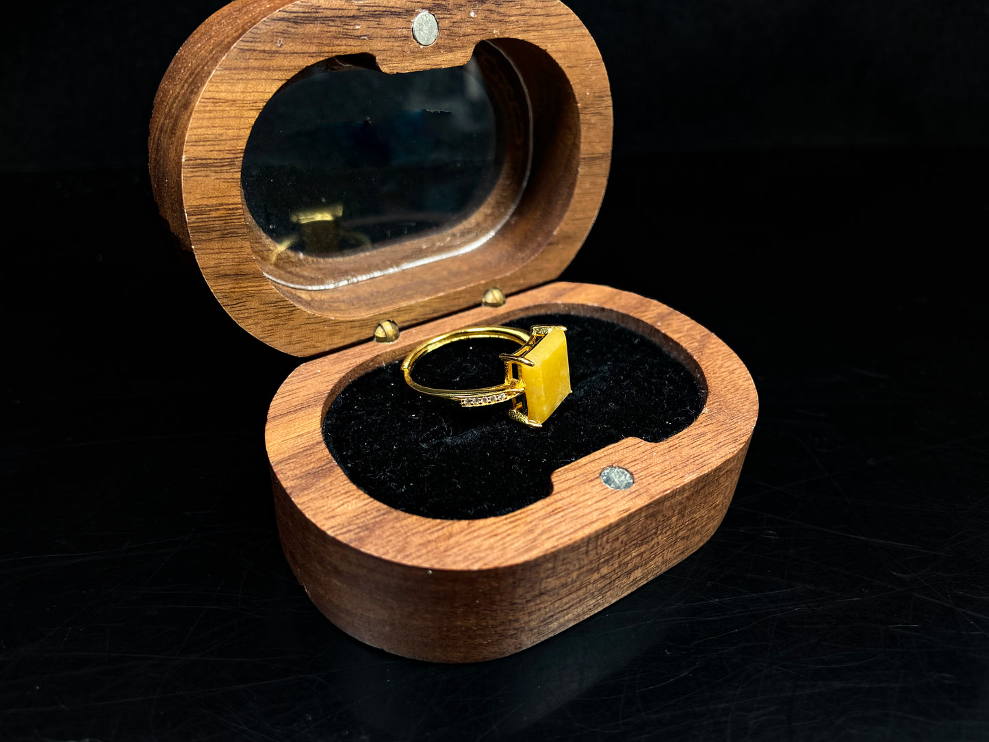 A rich yellow square jadeite ring.