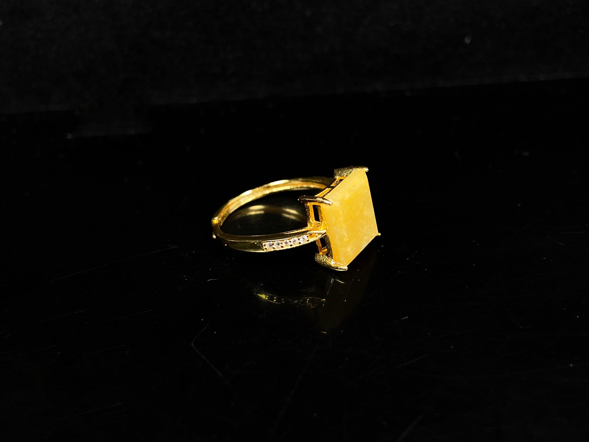 A rich yellow square jadeite ring.