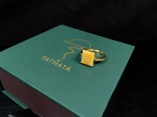 A rich yellow square jadeite ring.