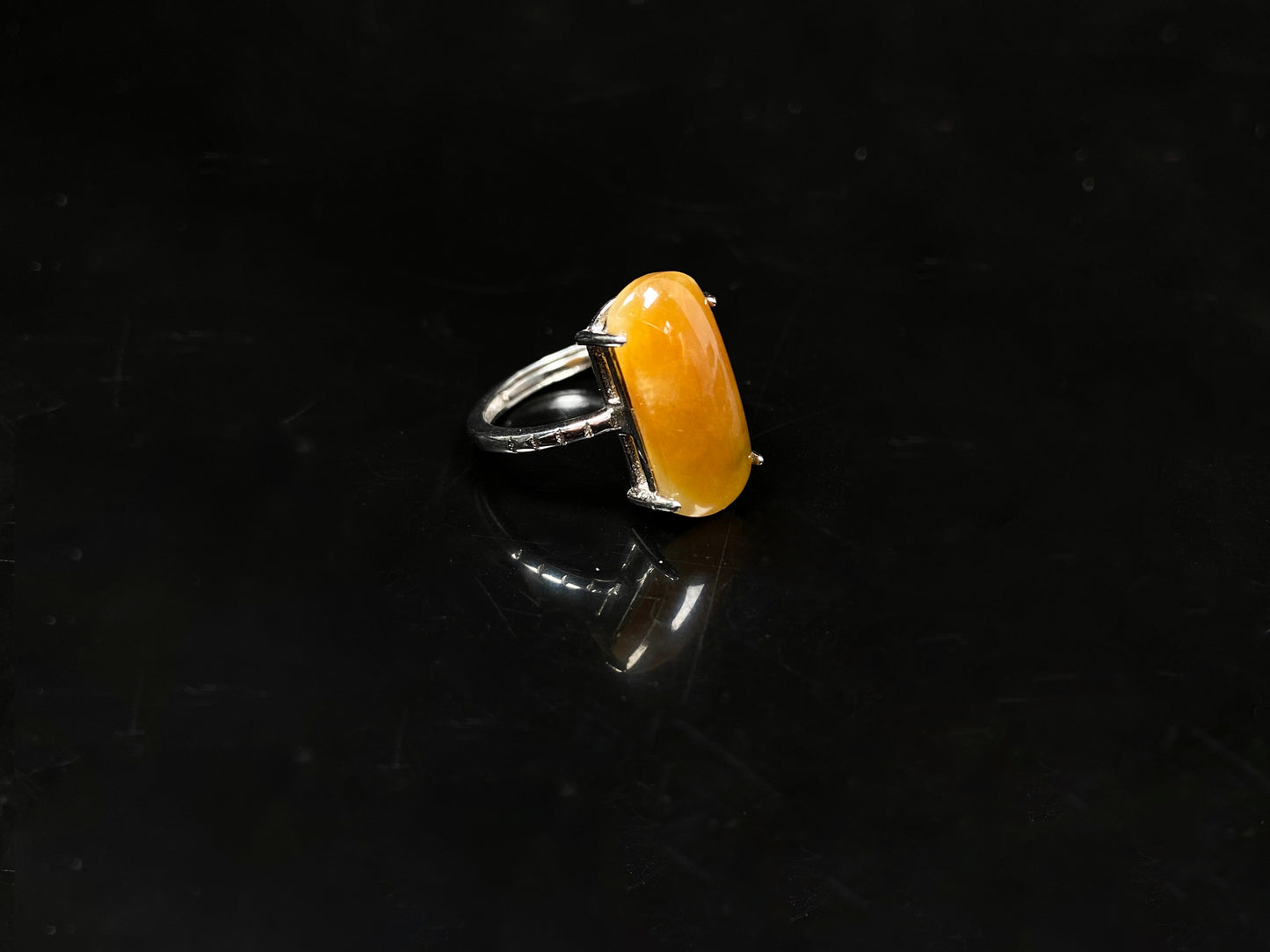 A butterscotch glow saddle jadeite ring.